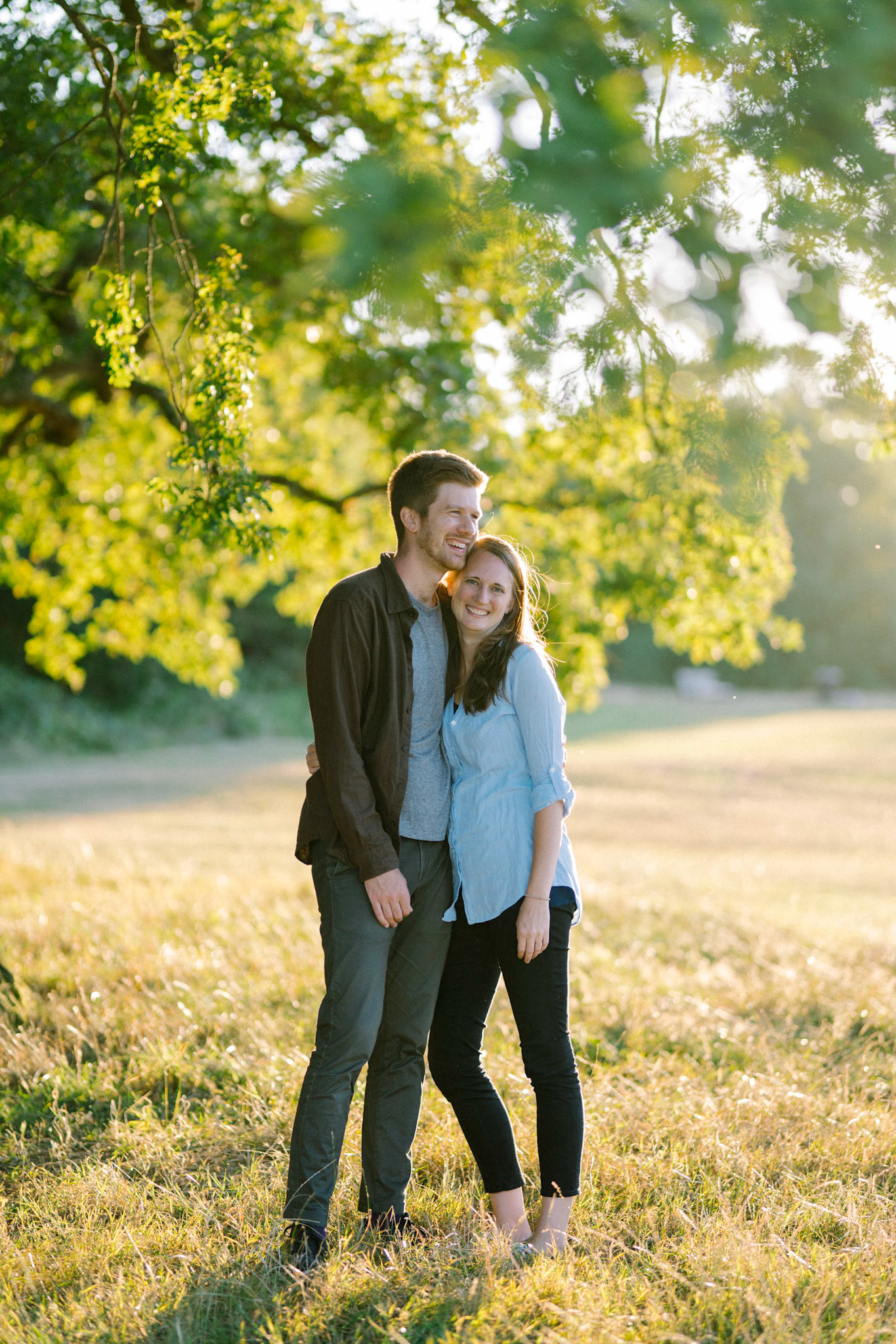 A couple share a happy moment together. Taken during and engagement photoshoot in Wimbledon