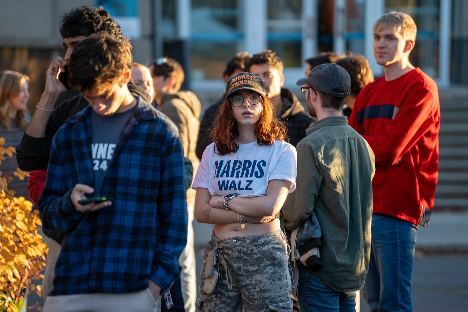 A student with a Harris Walz tshirt waits outside the Ben Shapiro Talk, Bailey Hall, Oct 28, 2024. (Ming DeMers/Sun Photography Editor)