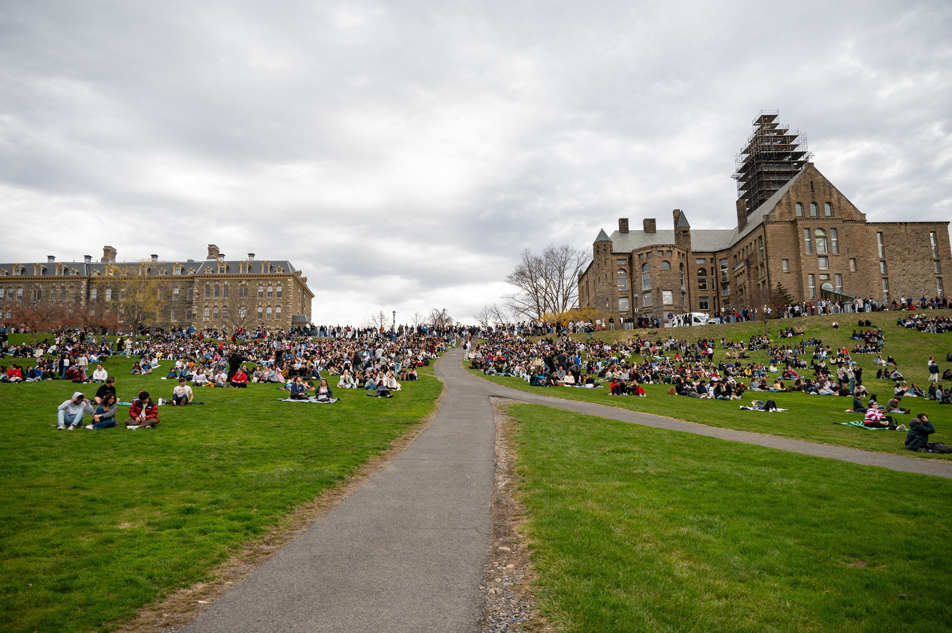Hundreds of students gathered to view the solar eclipse on Libe Slope, April 8th, 2024. (Ming DeMers/Sun Senior Photo)