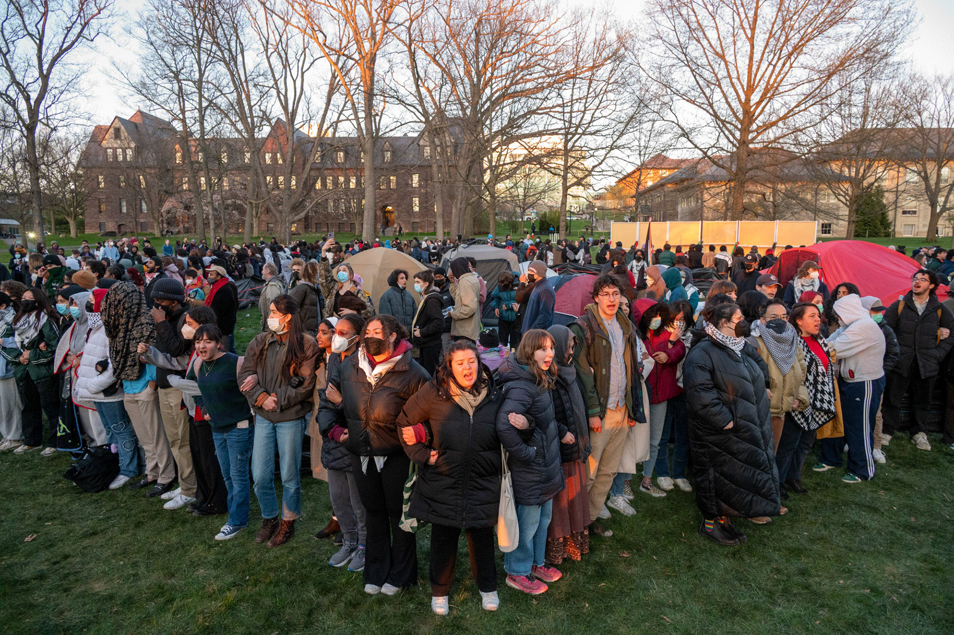 Protestors link arms around the CML Encampment on the Arts Quad, April 25th, 2024. (Ming DeMers/Senior Photo)