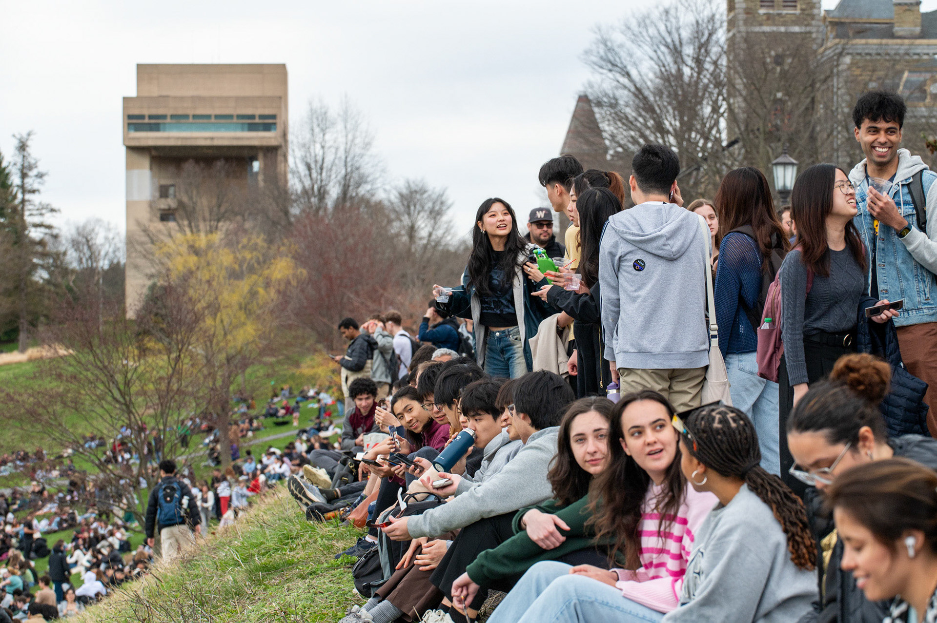 Hundreds of students gathered to view the solar eclipse on Libe Slope, April 8th, 2024. (Ming DeMers/Sun Senior Photo)