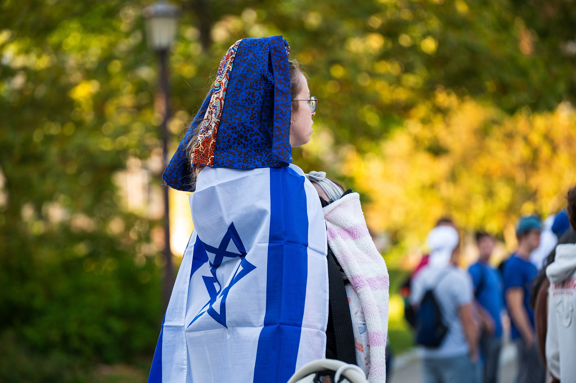 A mother holds her baby at the Cornellians for Israel's vigil at Ho Plaza on September 2nd, 2024. (Ming DeMers/Sun Photography Editor)