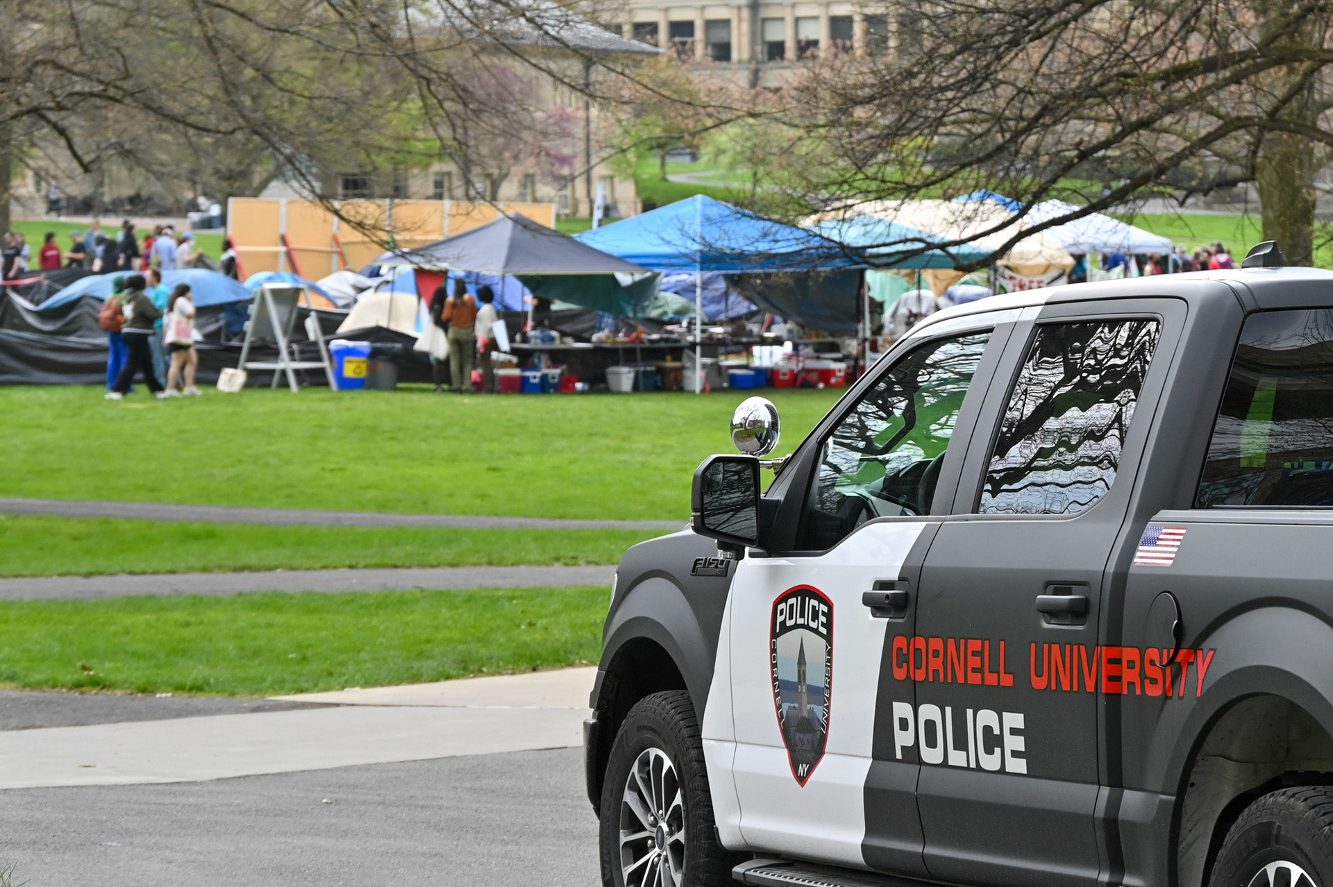 CUPD posts nearby the CML Liberated Zone Encampment on the Arts Quad, April 28th, 2024. (Ming DeMers/Sun Senior Photo)