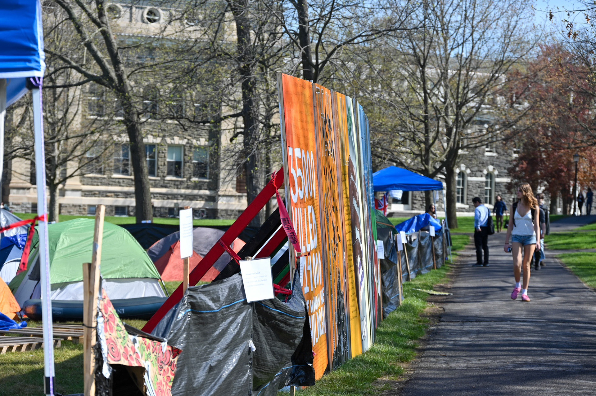 Students walk by the CML Liberated Zone Encampment Day 6, April 30th, 2024. (Ming DeMers/Sun Senior Photographer)