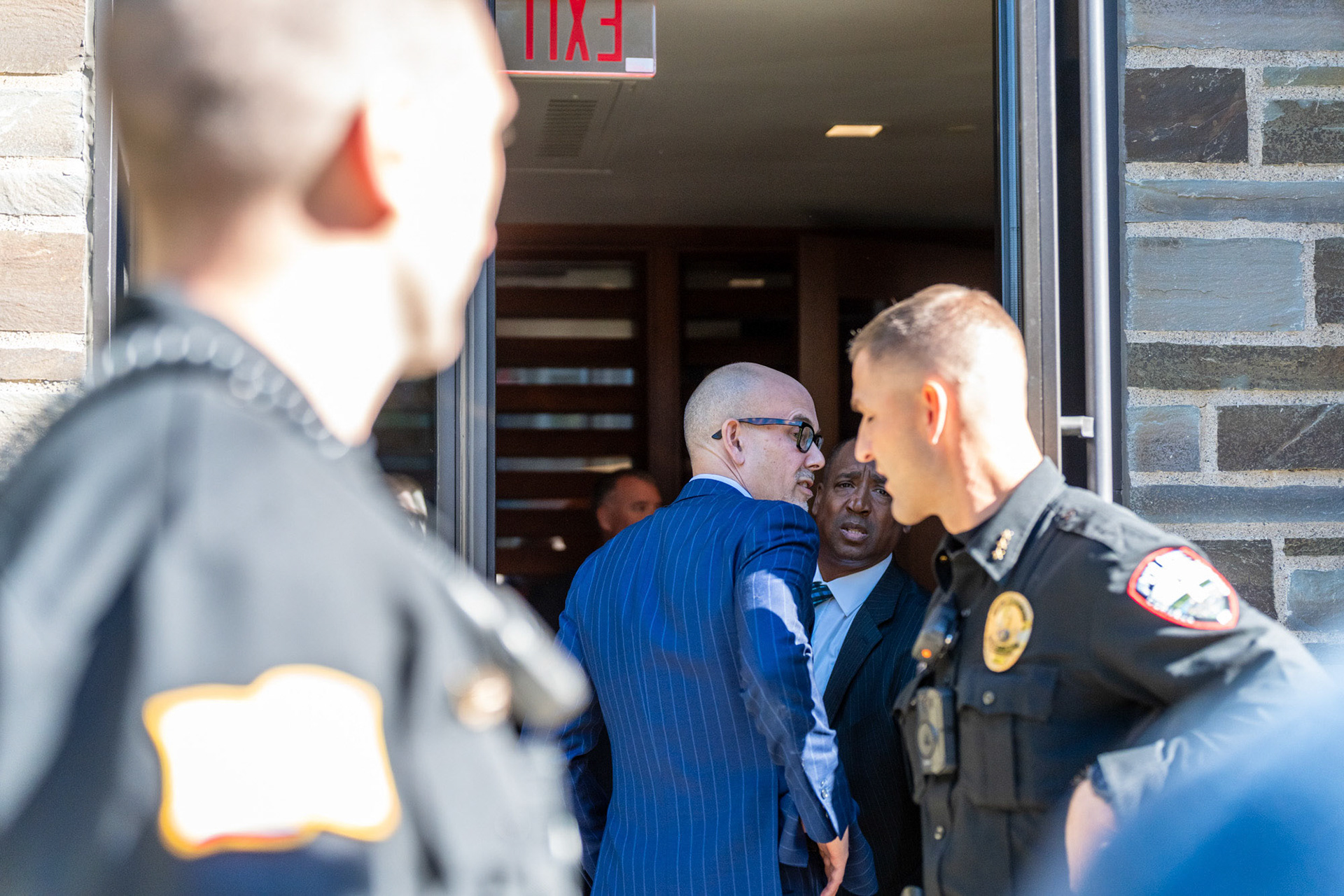 A board of trustees member goes back to the meeting at the CML Rally Walkout of the Board of Trustees Meeting at the Law School, Myron Taylor Hall Courtyard, Oct 18, 2024. (Ming DeMers/Sun Photography Editor)