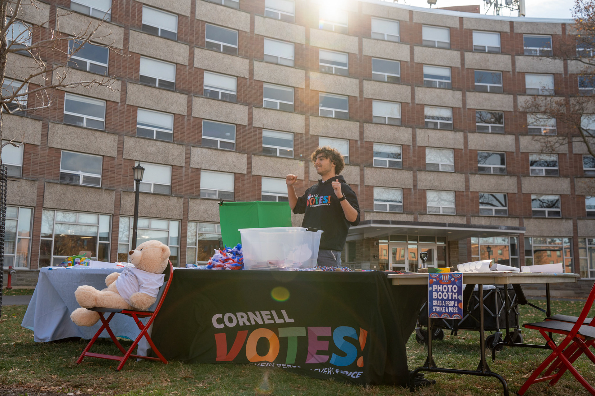 Erik Lapidus '27 tables outside for Cornell Votes, encouraging students to vote and make their own stickers, RPCC Voting location, Election Day, Nov 5, 2024. (Ming DeMers/Sun Photography Editor)