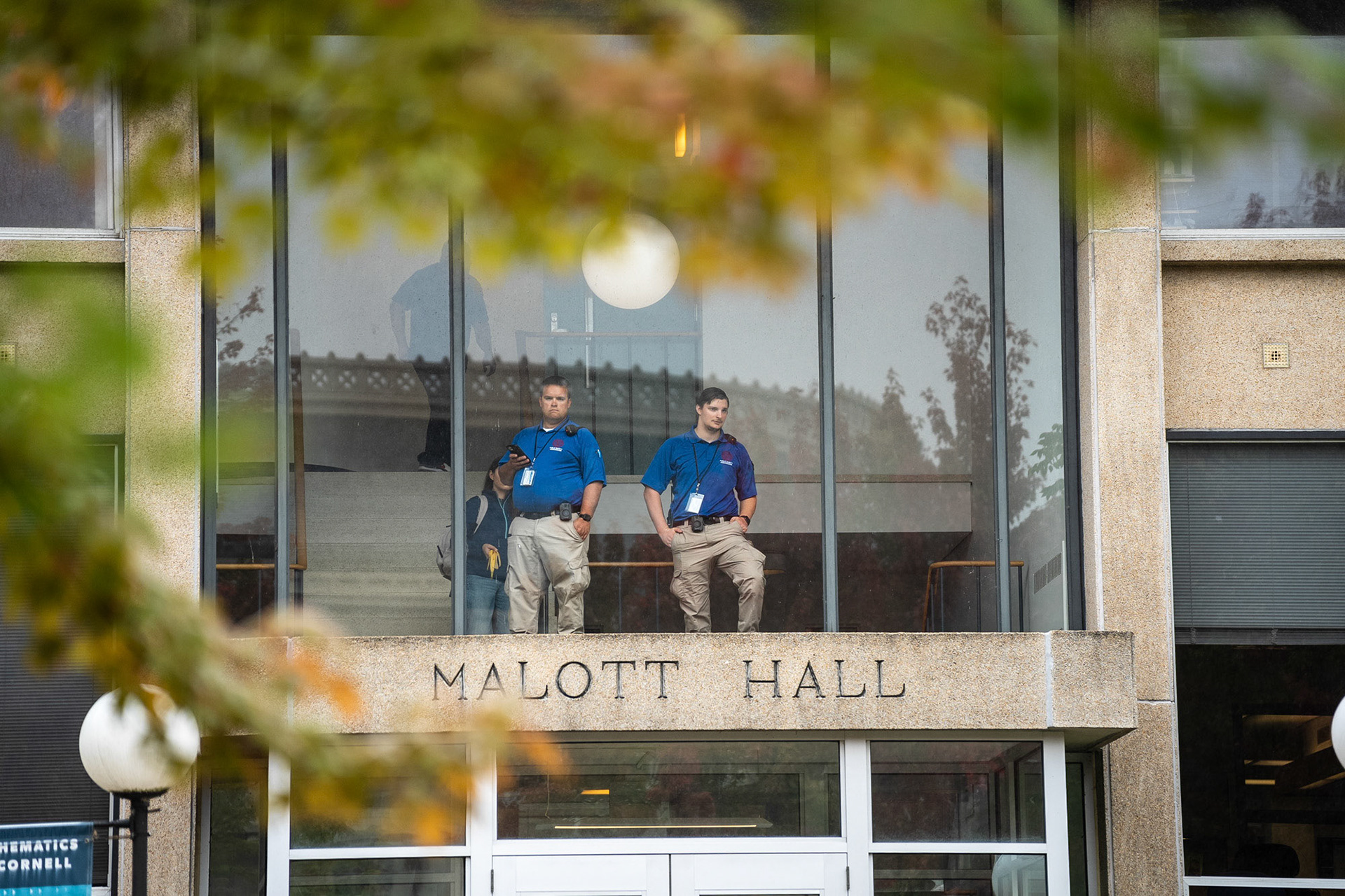 Public safety ambassadors watch on from Malott Hall at the CGSU Just Cause rally, Bailey Hall, Oct 2, 2024. (Ming DeMers/Sun Photography Editor)