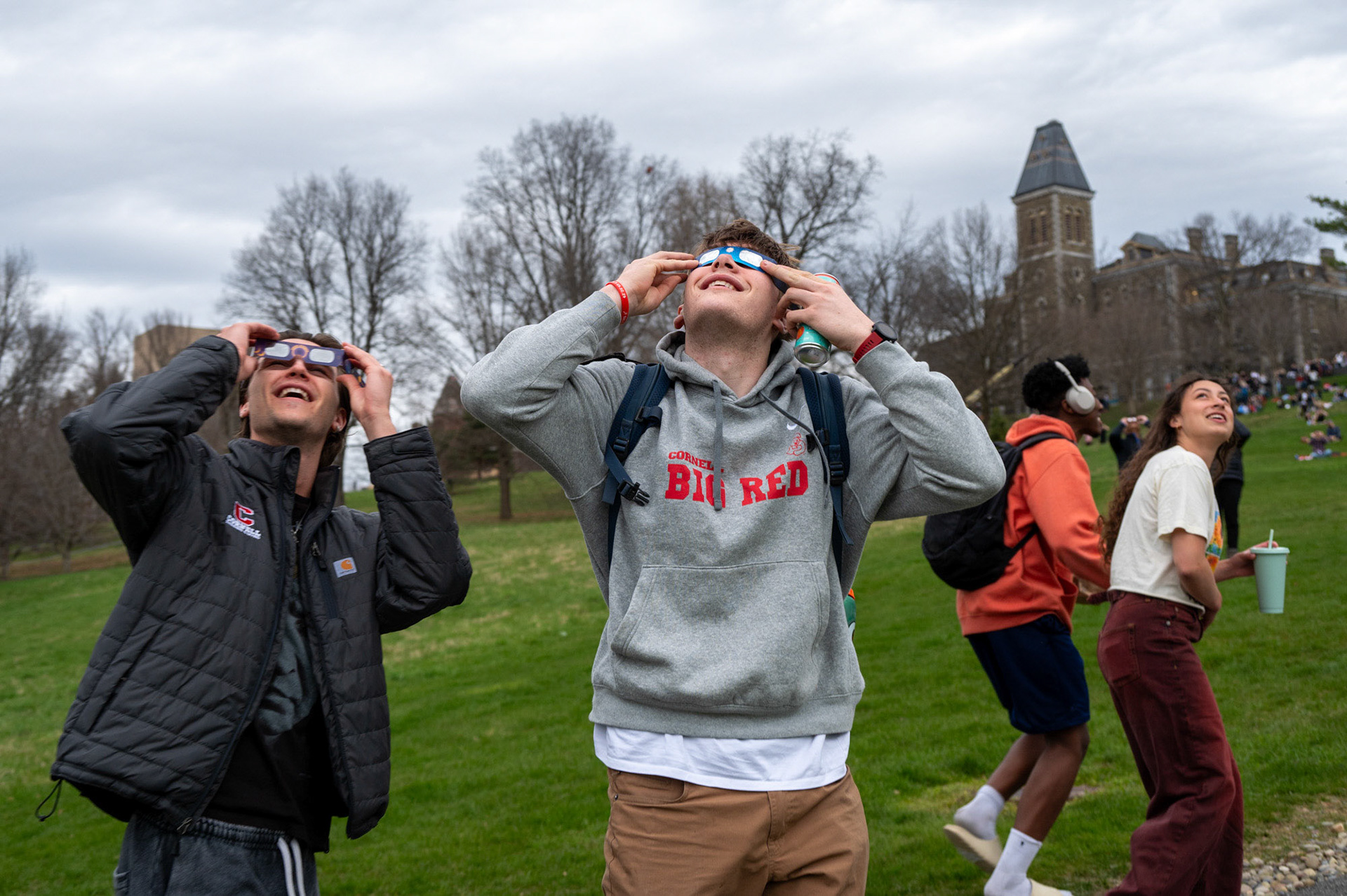 Students caught glimpses of the solar eclipse on Libe Slope, April 8th, 2024. (Ming DeMers/Sun Senior Photo)