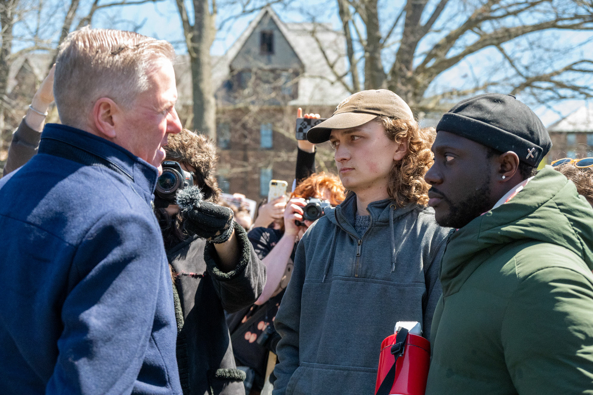 Two leaders and Cornell Admin discuss at the CML Encampment on the Arts Quad, April 25th, 2024. (Ming DeMers/Senior Photo)