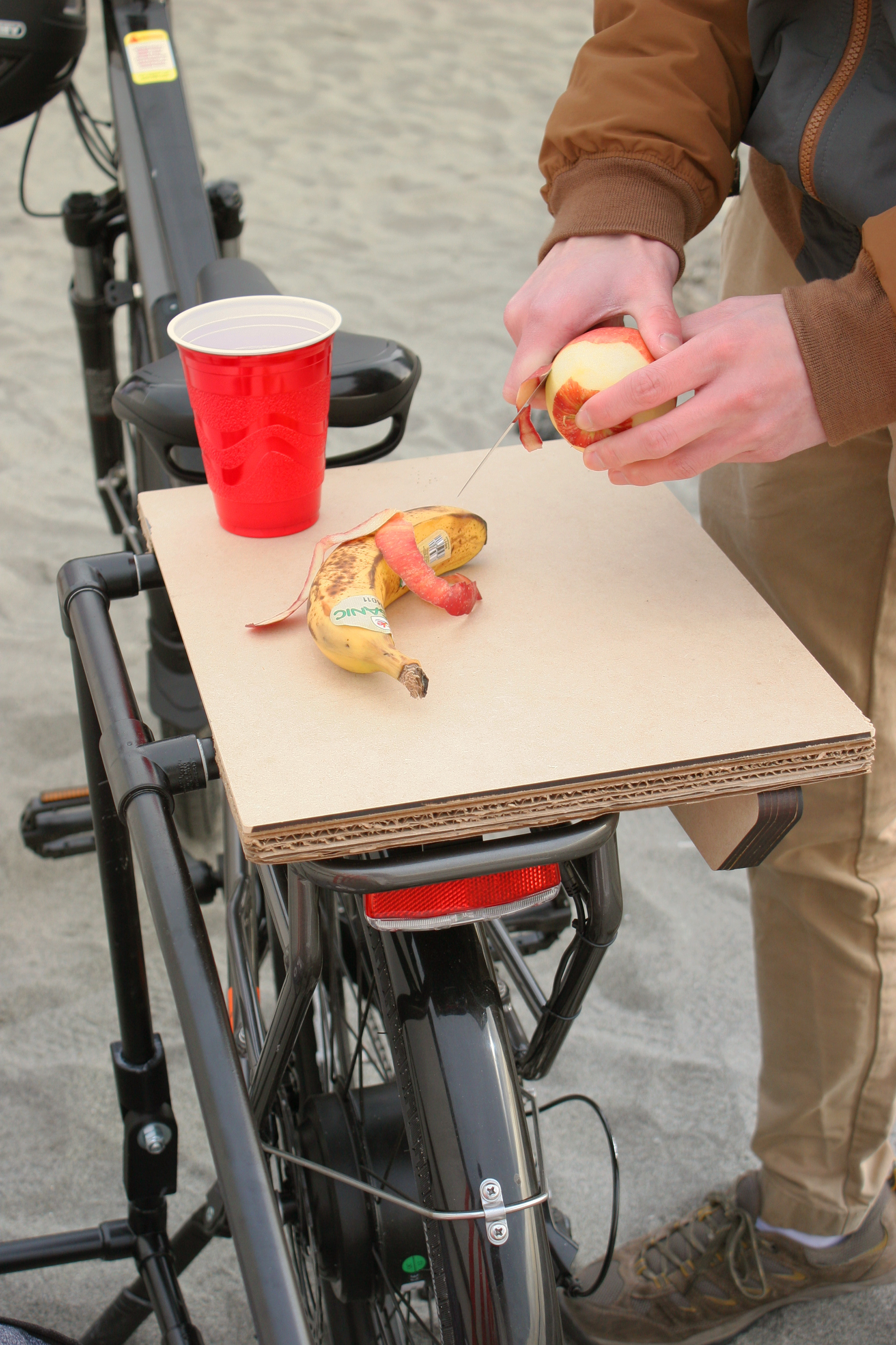 Integrating a workable surface gives our user the space they need without having to carry an additional item. In this case, our table replaces a foldable one.