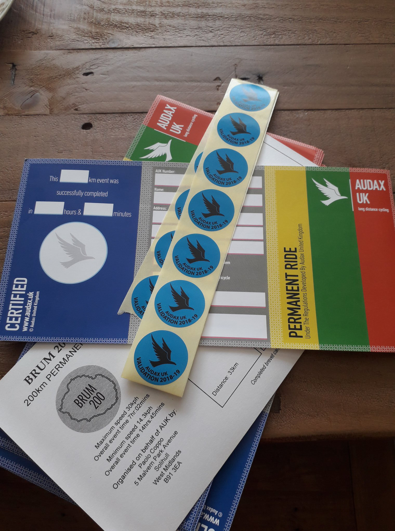 Custom brevet cards and stamps featuring the BRUM 200 logo. The logo was designed to be adaptable across formats, ensuring clarity and recognisability on smaller items.
