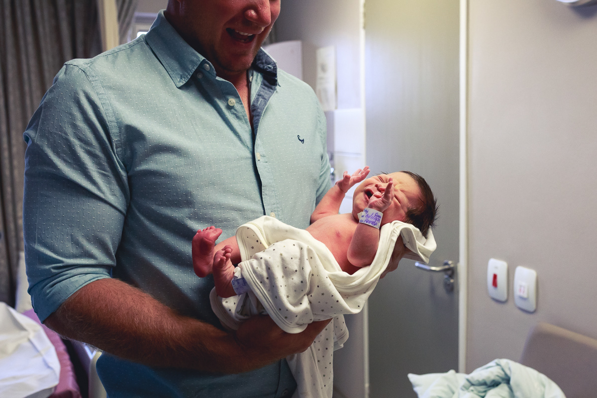 Father holding baby girl