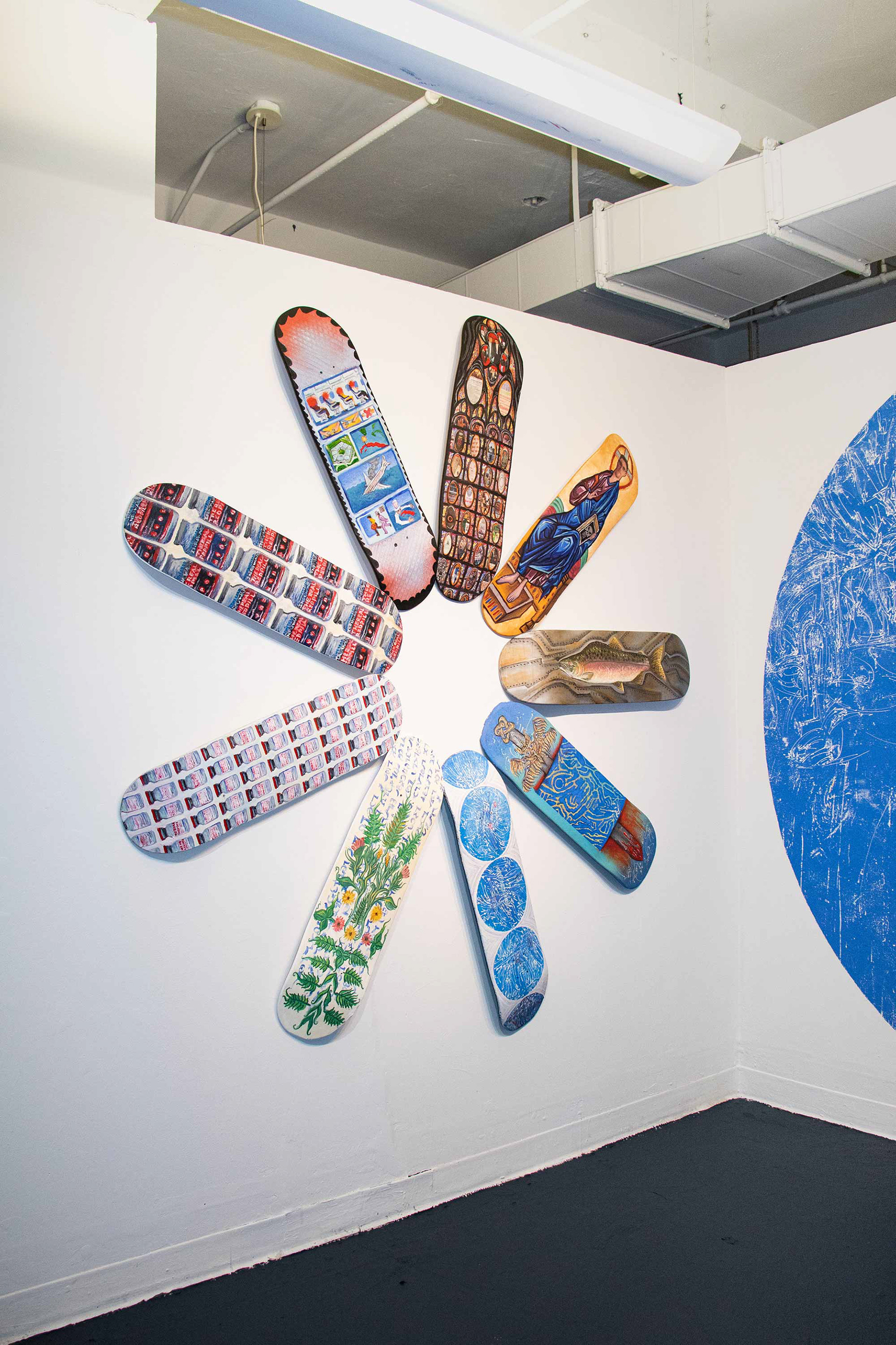 Wheel of Fortune. 2021. 6' x 6' Oil and collage on (9) 32" x 8.5" wooden skateboard decks