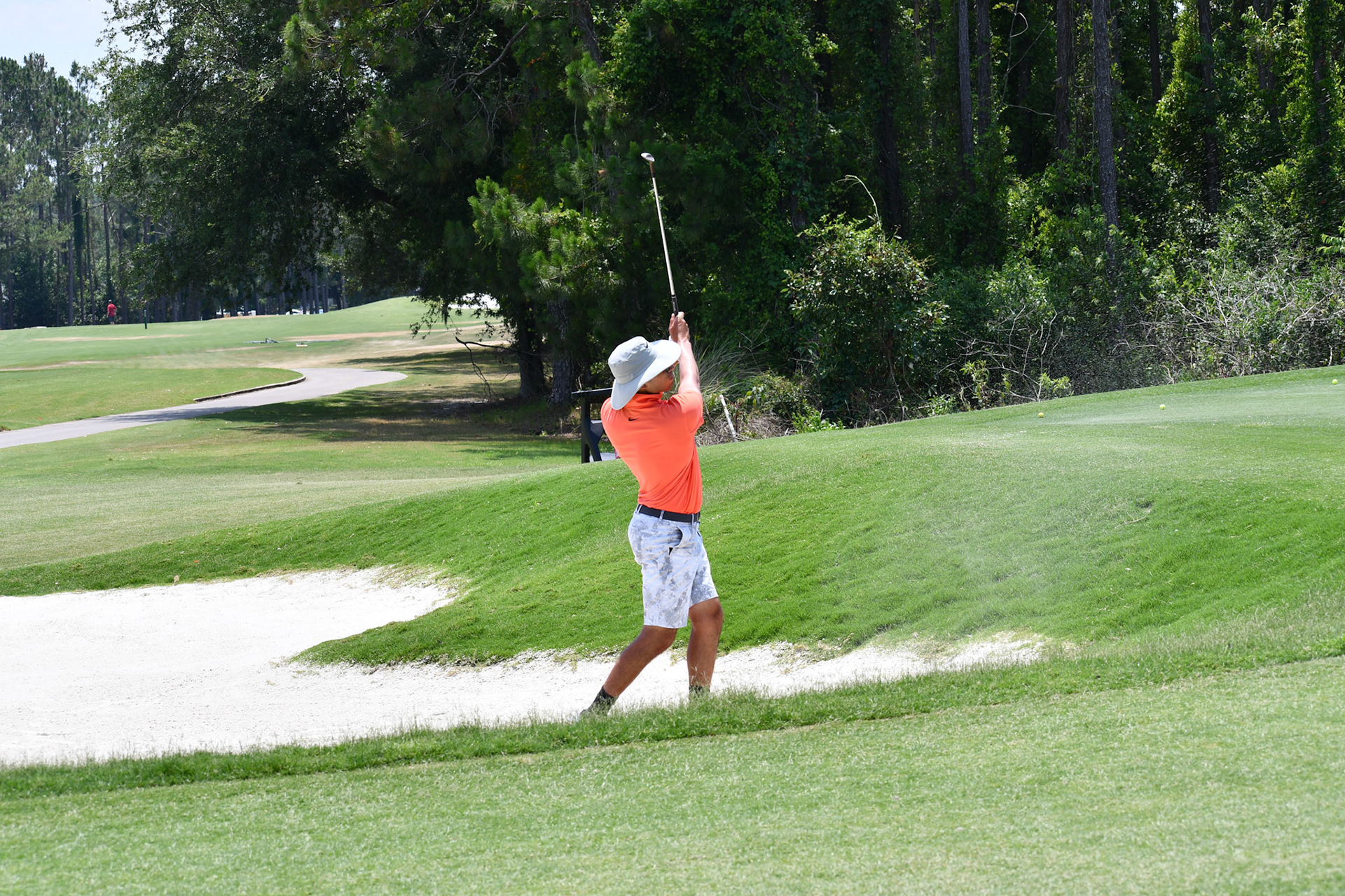 Devin practicing bunker shots in FL