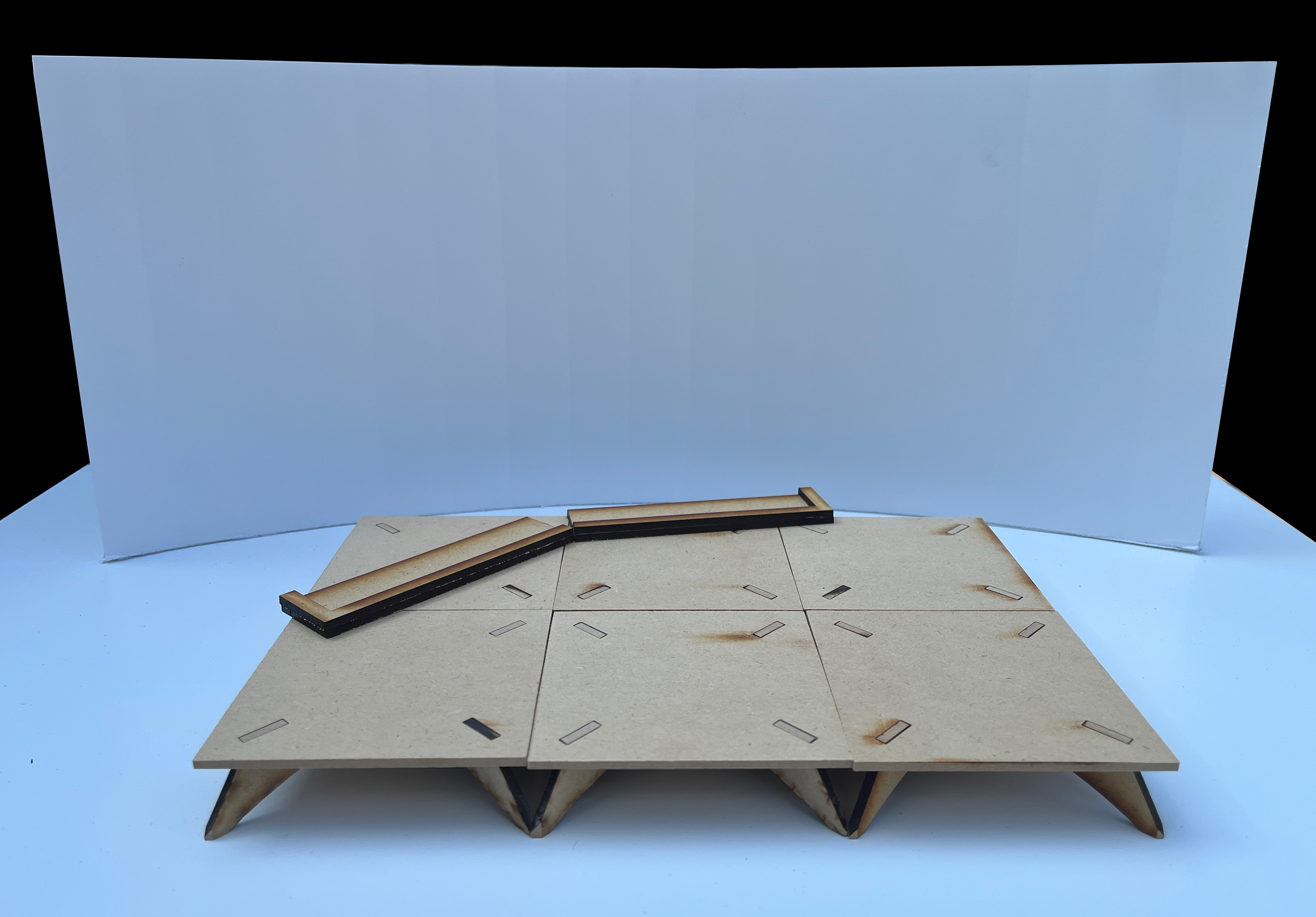 A miniature set showing the risers and beds in front of the wall.