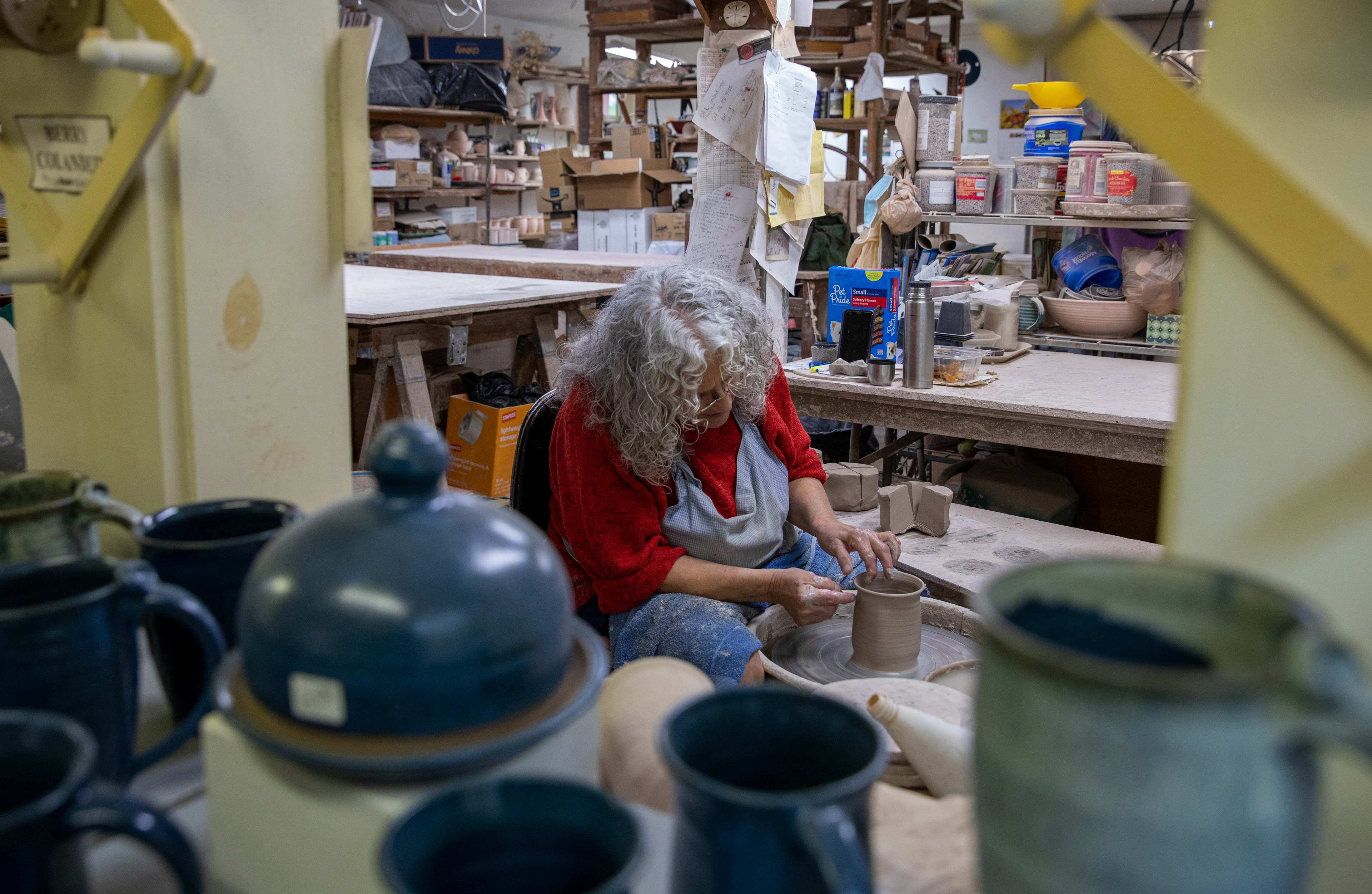 Susan Abramovitz, 71, fixing the rim of the thrown mug in her studio at Rock Riffle Run Pottery on October 12, 2022.