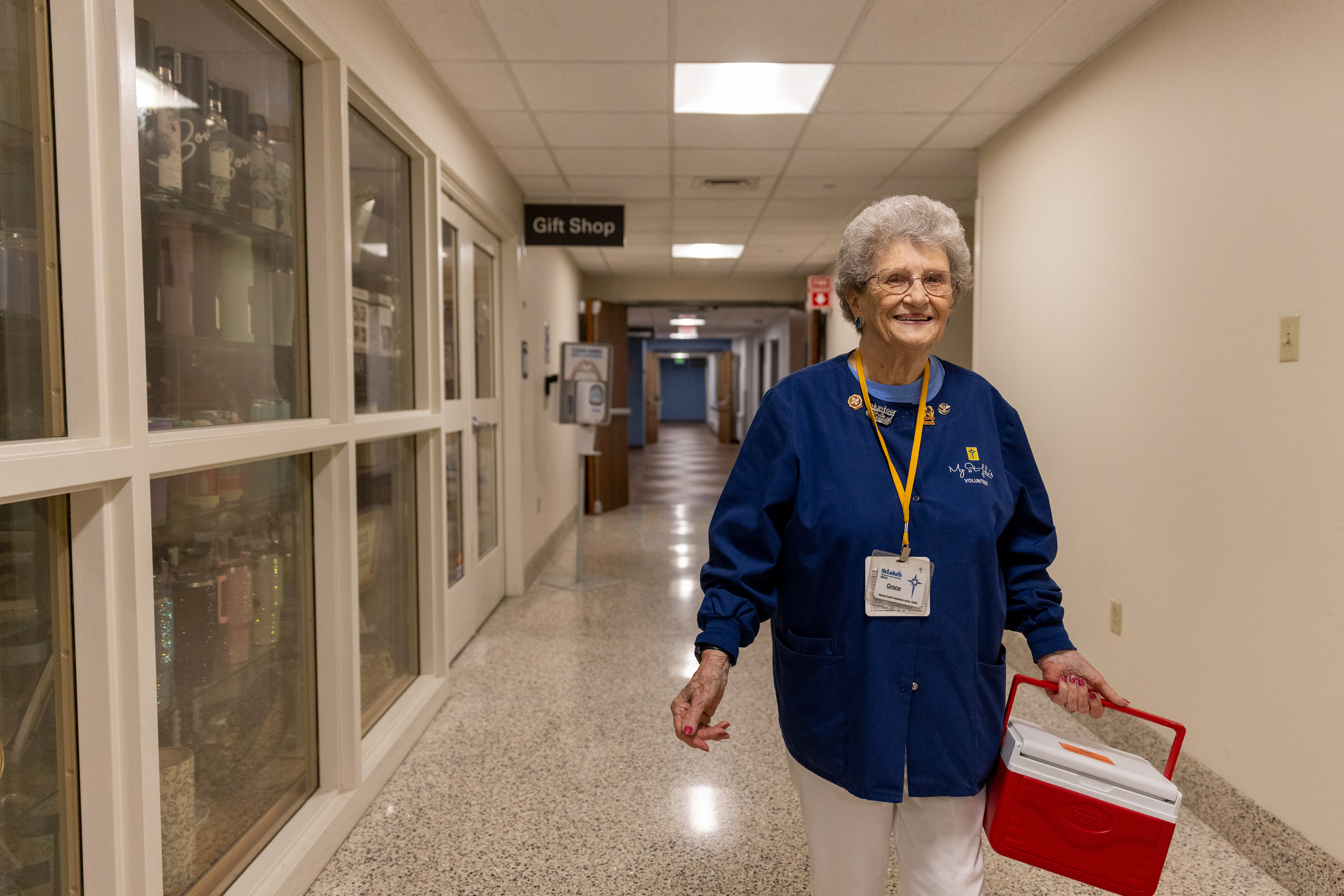 Grace Carr, a volunteer at St. Luke’s Hospital-Sacred Heart, walks down the hallway Wednesday, July 31, 2024, in Allentown. Carr recently turned 97 and has been volunteering at the hospital each Wednesday since 1993. 