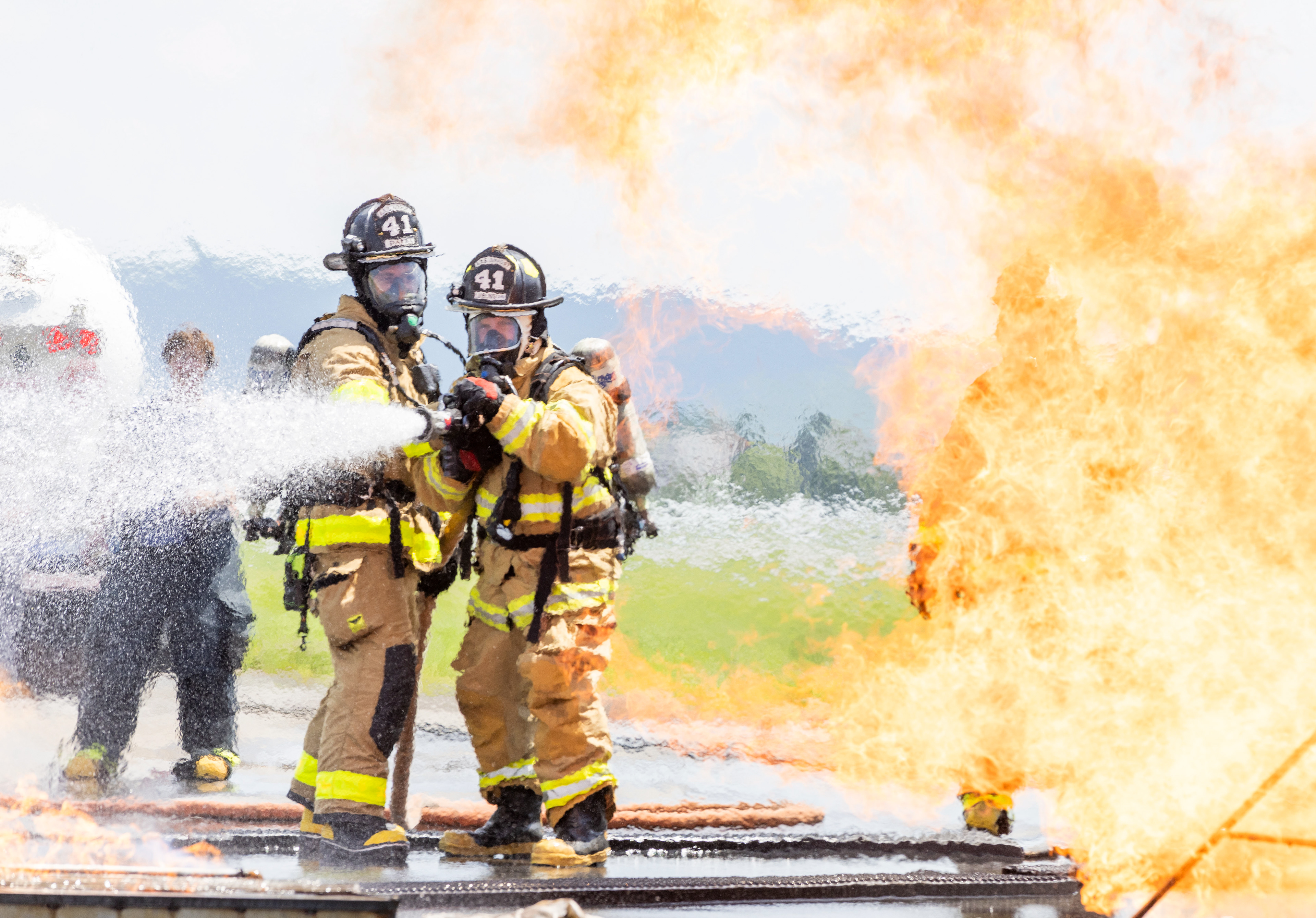 Media personnel and firefighters participate Tuesday, May 21, 2024, in a live-fire training exercise at Lehigh Valley International Airport in Allentown. The Lehigh-Northampton Airport Authority’s Aircraft Rescue and Firefighting Division hosted the exercise which included a 50-foot mock aircraft fuselage and a 1,300-square-foot live-fire area designed to replicate aircraft fuel fires.