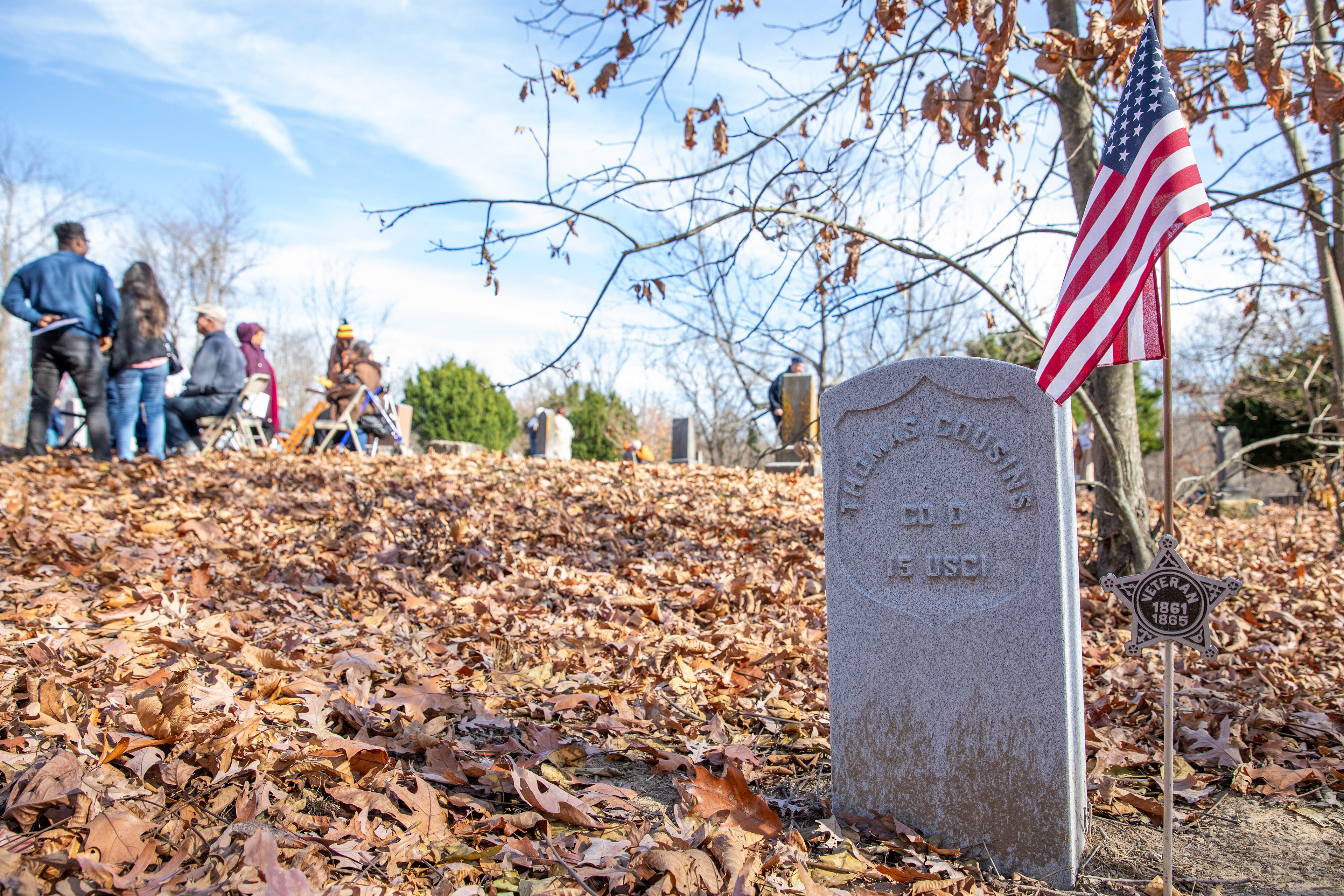 The headstone of Thomas Cousins is seen during the Headstone Rededication Ceremony at the Rendville Cemetery.