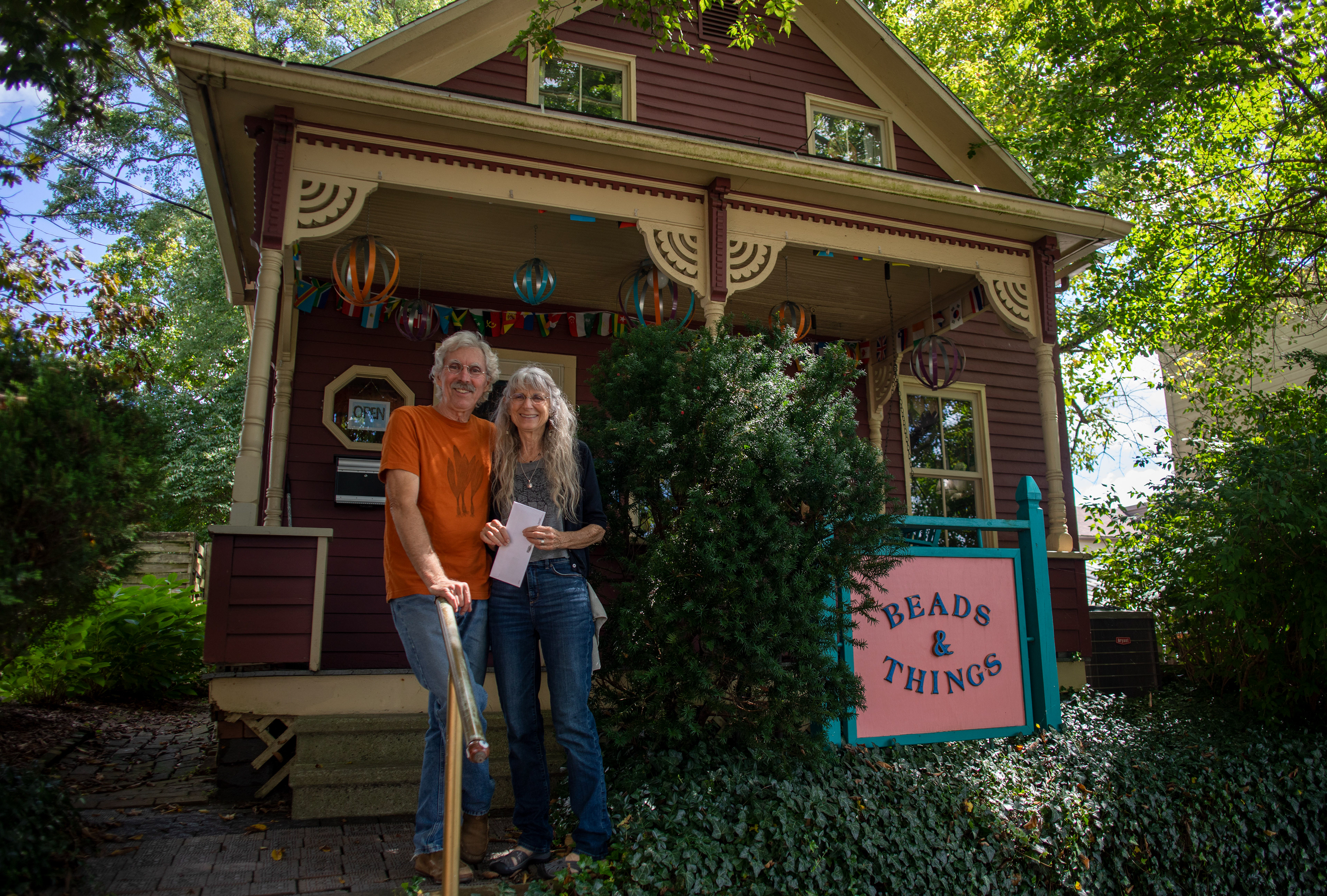 Joey (Jo) Merkle, 69, and Phil Berry, 67, posed outside their business, Beads and Things in Athens, Ohio, on September 9, 2022. 
