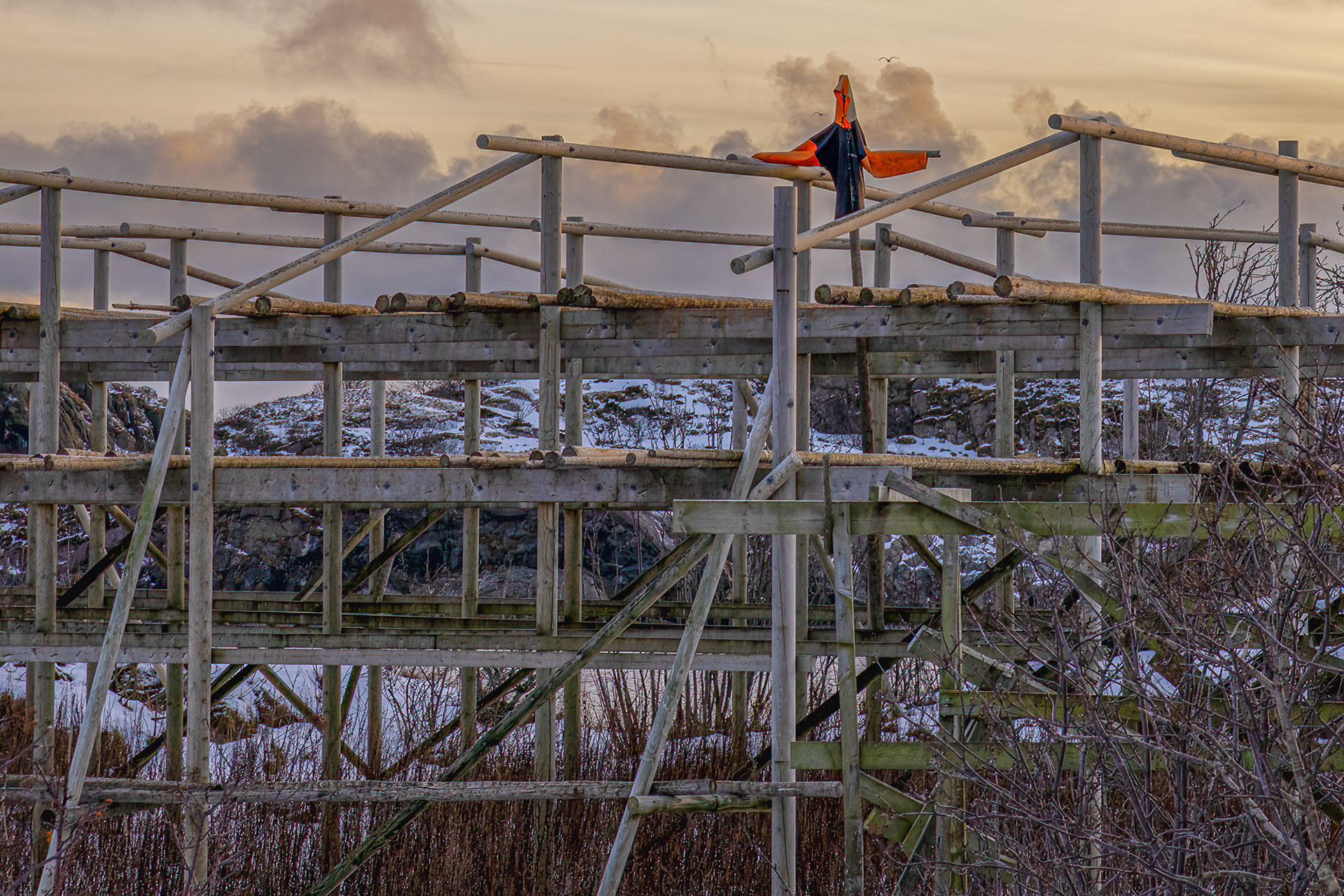 scarecrow on fish drying racks.  one of the very few scrarecrows we saw