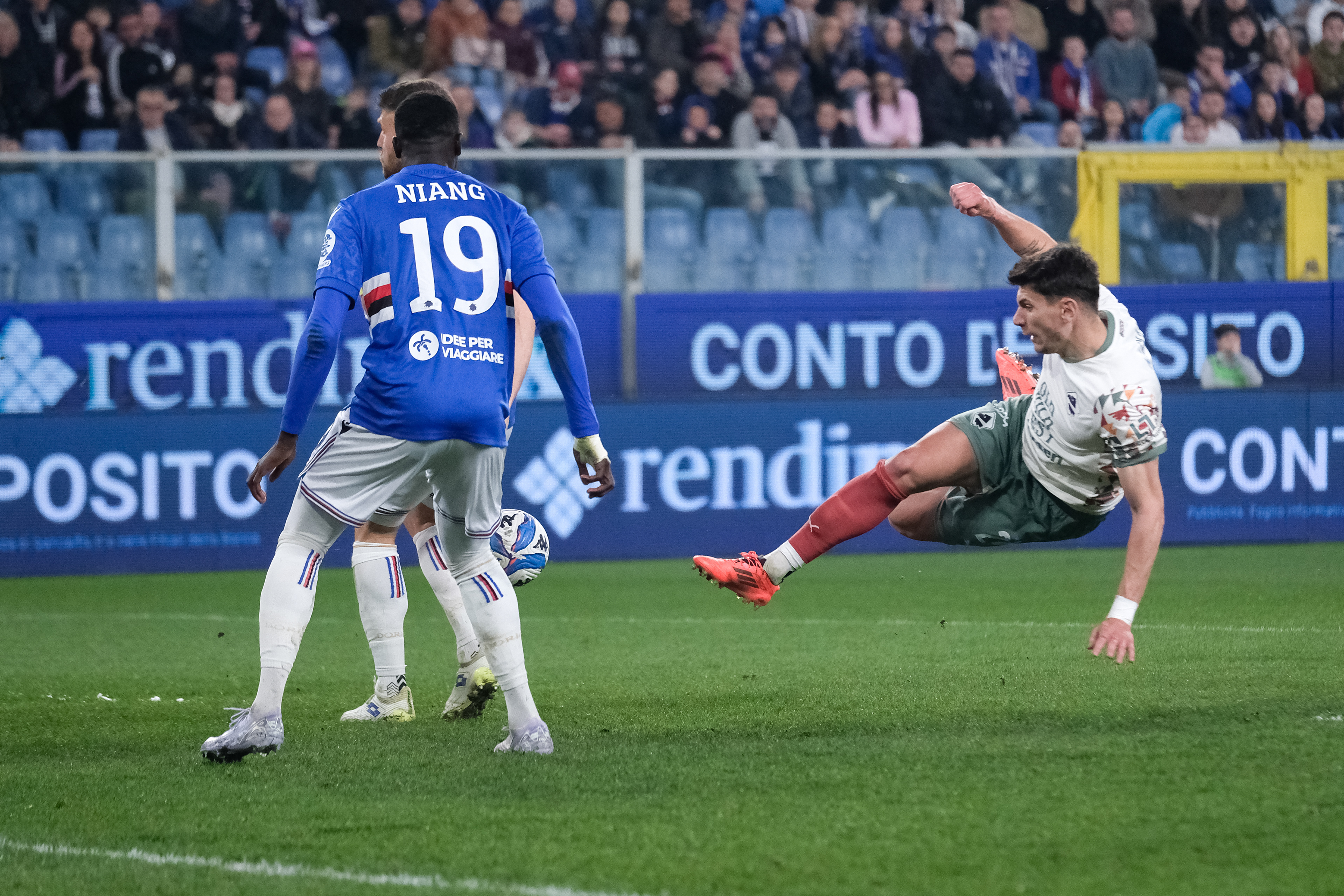 PALERMO v SAMPDORIA - Serie B // GENOVA, ITALY - MARCH 08: Giangiacomo Magnani of FC Palermo doing a half backflip and M'Baye Niang of UC Sampdoria in action during the Serie B match between UC Sampdoria and Palermo FC at Stadio Luigi Ferraris on March 08, 2025 in Genova, Italy. (Photo by Federico Serra)