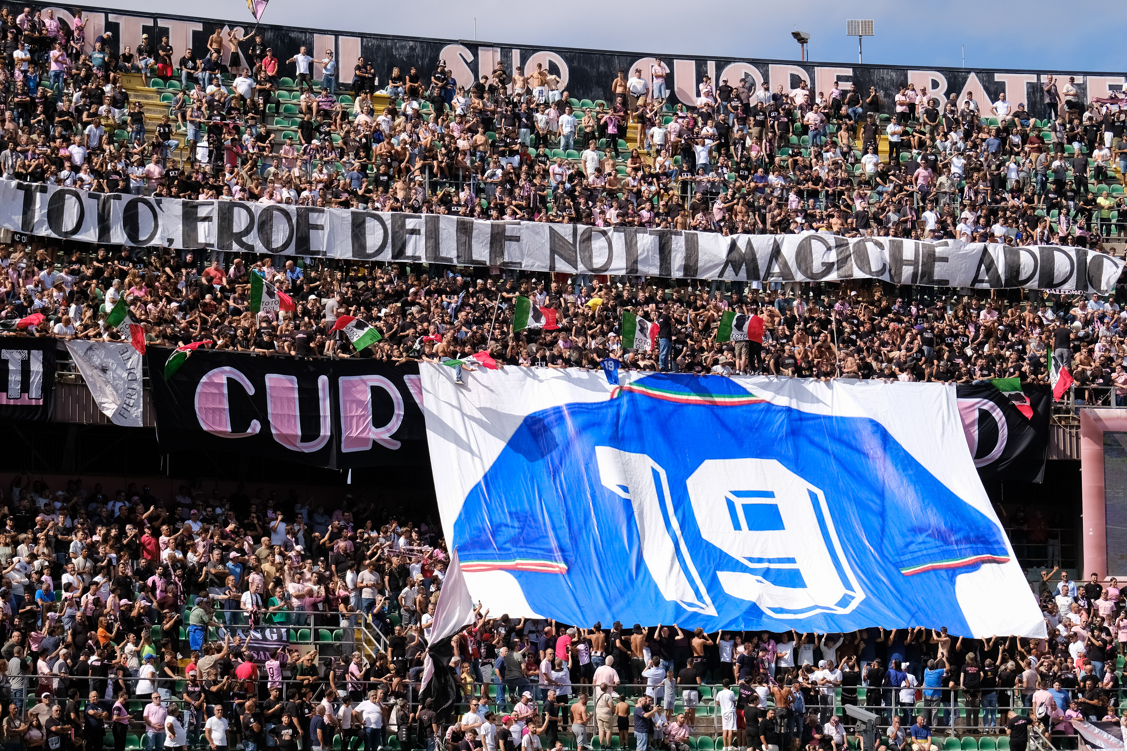 PALERMO v CESENA - Serie B // PALERMO, ITALY - SEPTEMBER 29: Palermo FC's supporters showing a banner and a choreography in memory of Salvatore Schillaci during the Serie B match between Palermo FC and Cesena at Stadio Comunale Renzo Barbera on september 29, 2024 in Palermo, Italy. (Photo by Federico Serra)
