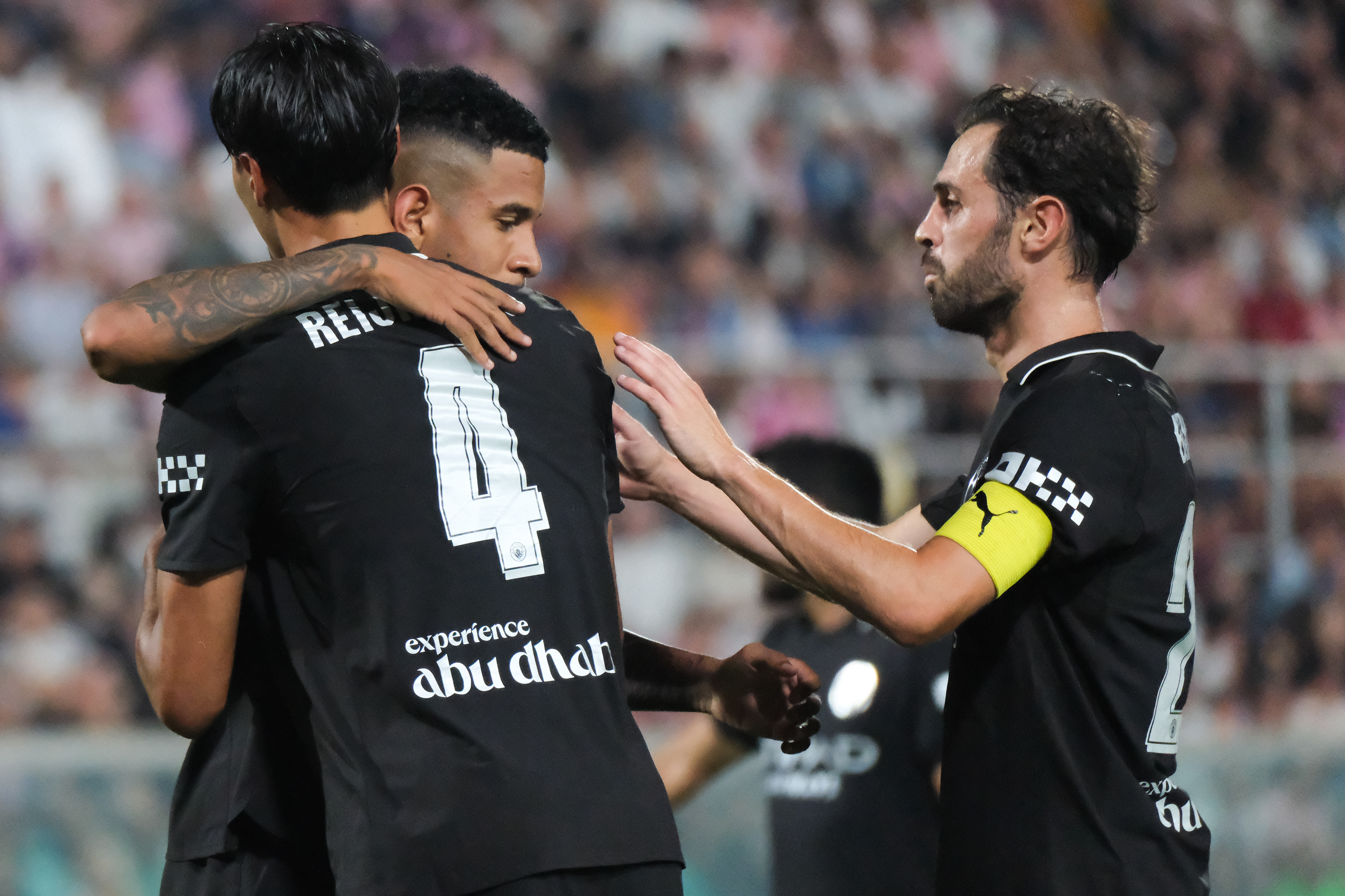 PALERMO FC v MANCHESTER CITY - Anglo Palermitan Trophy // PALERMO, ITALY - AUGUST 09: Tijjani Reijnders (L) and Bernardo Silva (R) of Manchester City celebrating a gol during the friendly match between Palermo FC and Manchester City at Stadio Comunale Renzo Barbera on august 09, 2025 in Palermo, Italy. (Photo by Federico Serra)