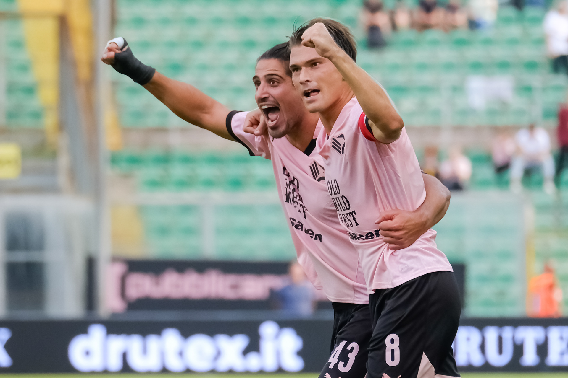 PALERMO v REGGIANA - Serie B // PALERMO, ITALY - OCTOBER 26: Dimitrios Nikolaou (L) of Palermo FC and Jacopo Segre (R) of Palermo FC celebrate Roberto Insigne's lead goal (1-0), during the Serie B match between Palermo FC and Reggiana at Stadio Comunale Renzo Barbera on october 26, 2024 in Palermo, Italy. (Photo by Federico Serra)