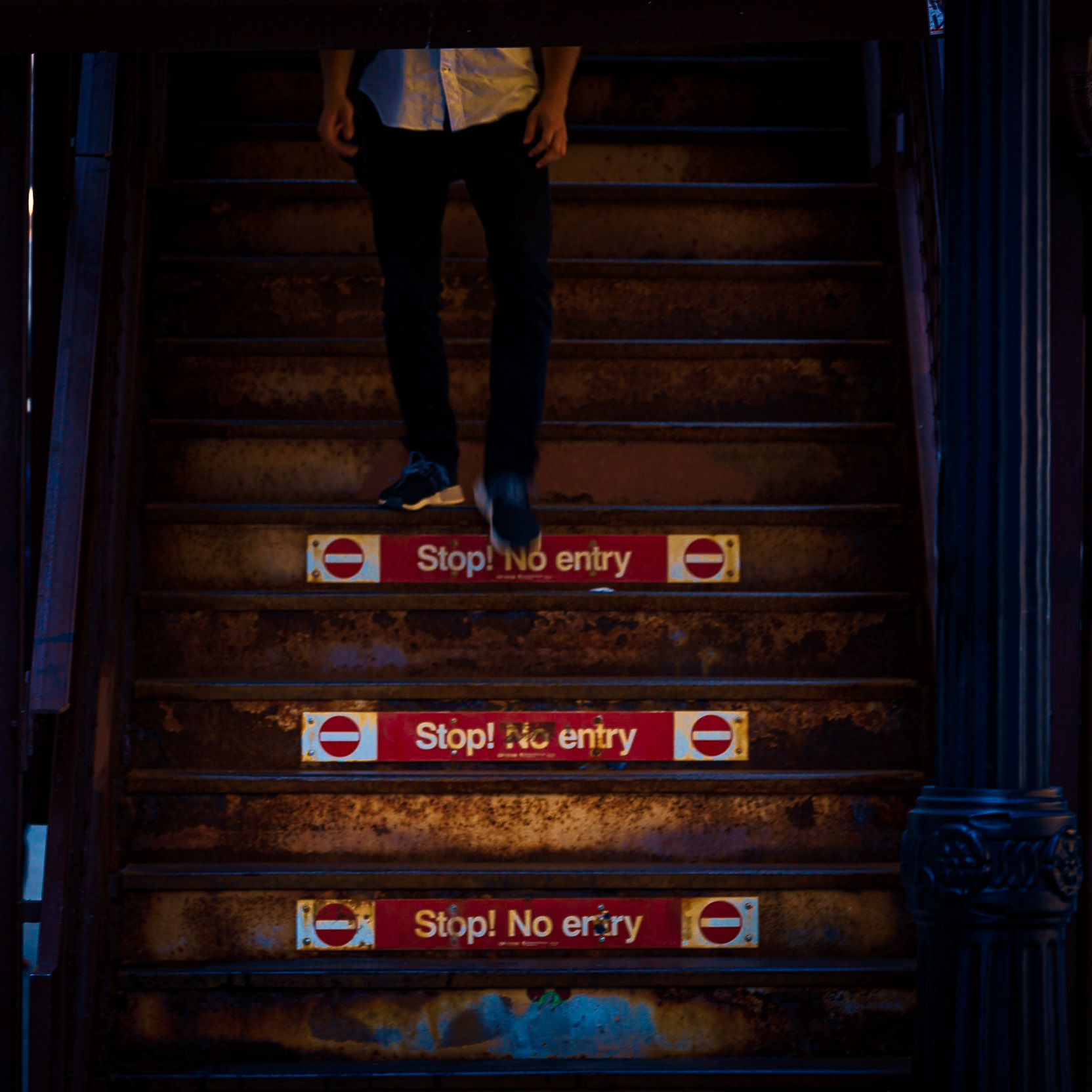 Chicago pedestrian, pre-COVID days. A young man walks down the rusty steel El stairs at the Wabash &amp; Washington CTA station....#pedestrian #walking #citylife #summer #wabash #wacker #chicago #downtownchicago #precovid19 #alone #cta #chicagocta #elevatedtrain #trains #concretejungle #steel #rust #streetshot #streetleaks