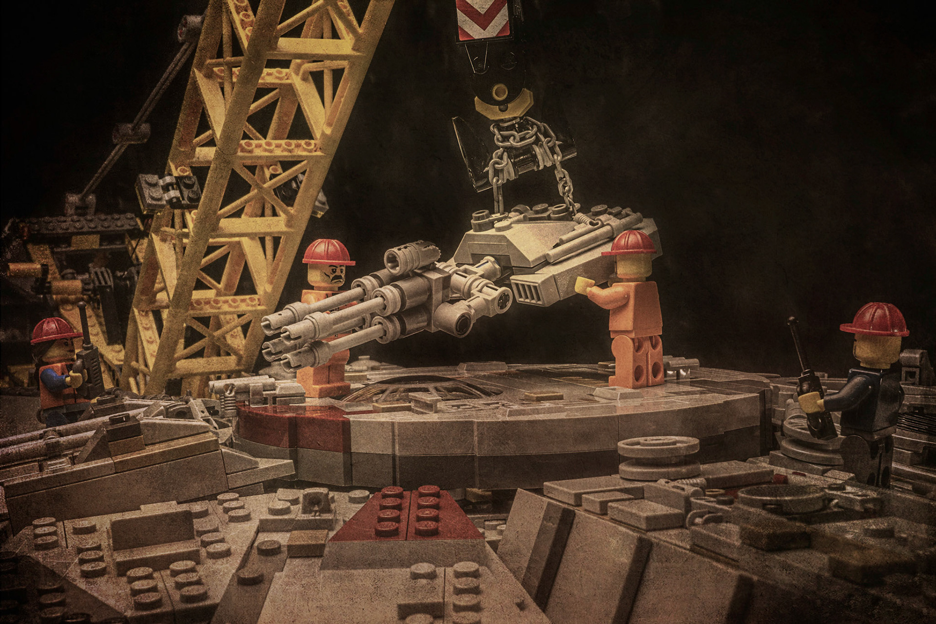 Historical photos of workers installing the main cannon on the Millennium Falcon