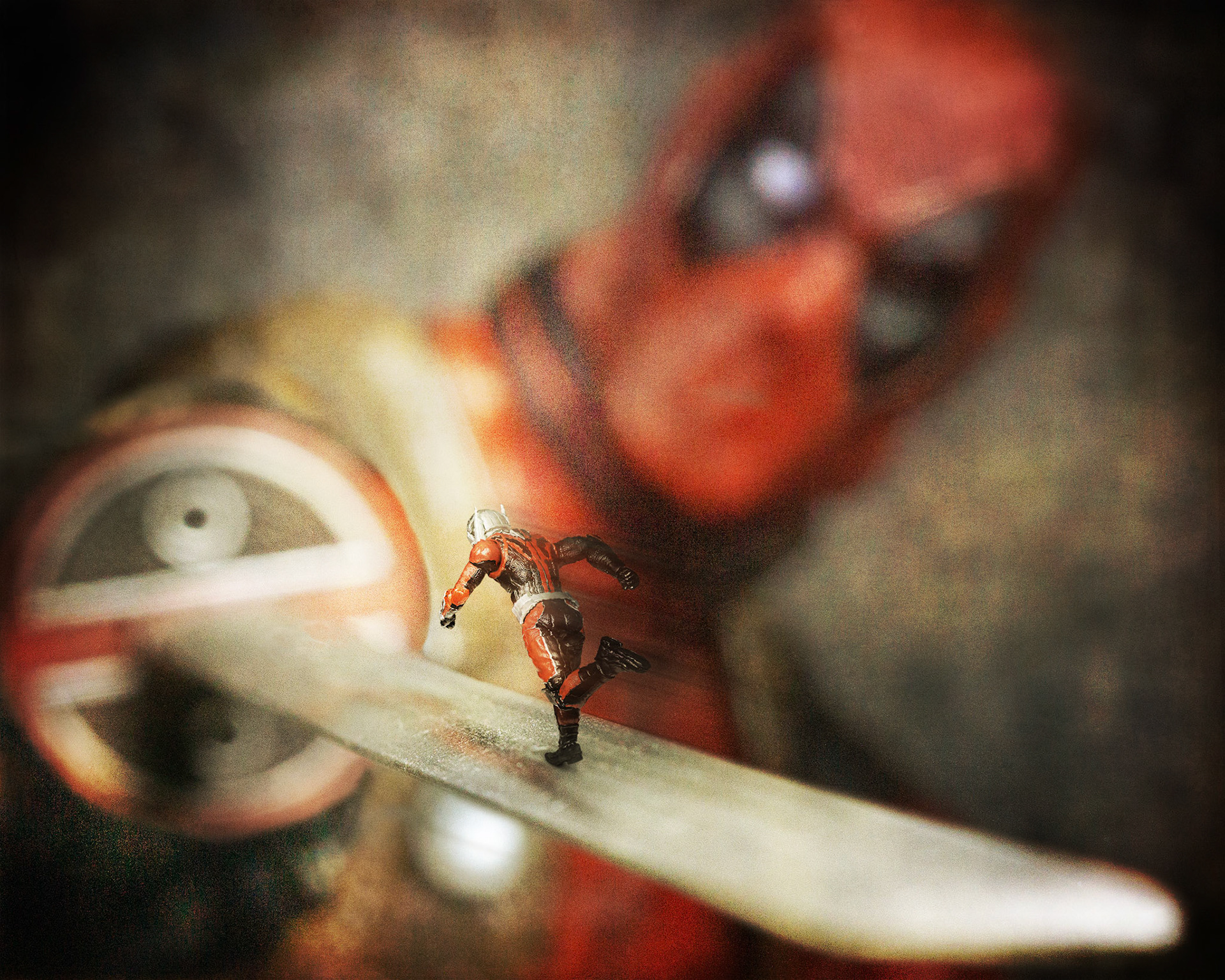 Ant-Man running along Deadpools sword