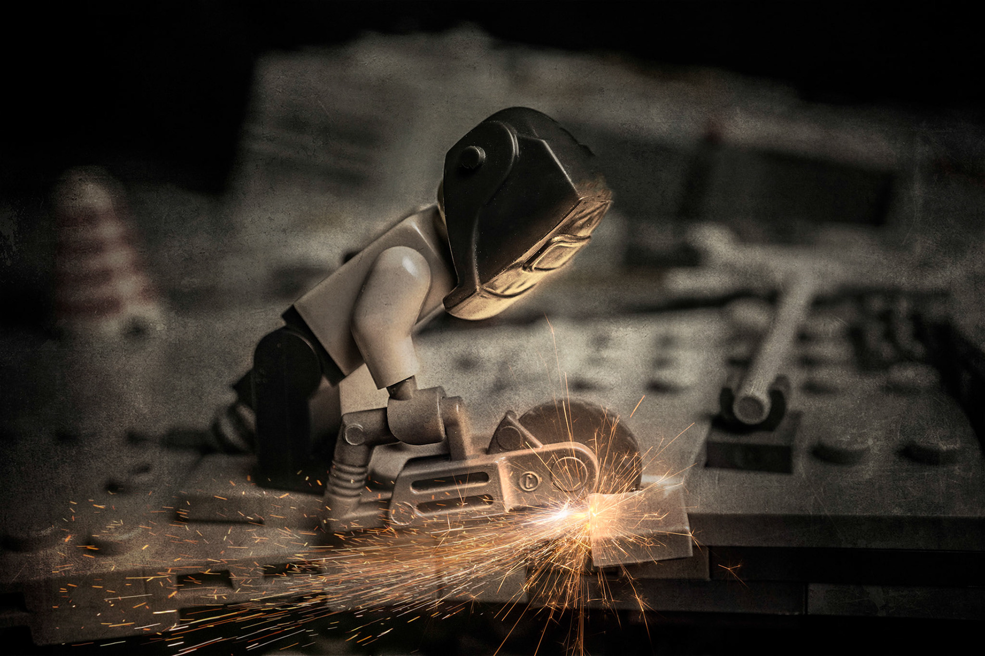 Historical photos of a worker cutting steal plating on the Millennium Falcon.