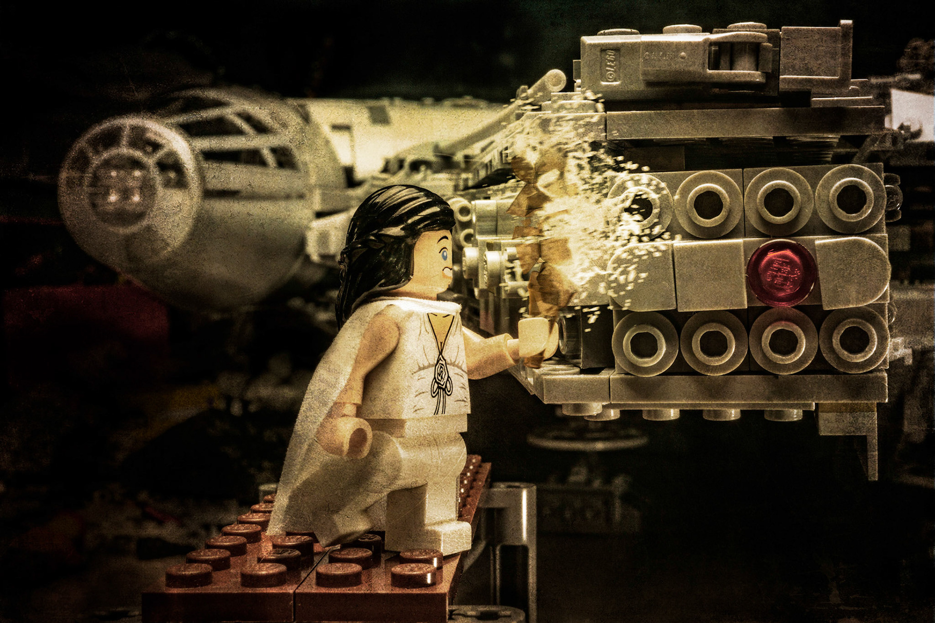 Historical Photos of a lady christening the Millennium Falcon by breaking a bottle of champagne on the hull.