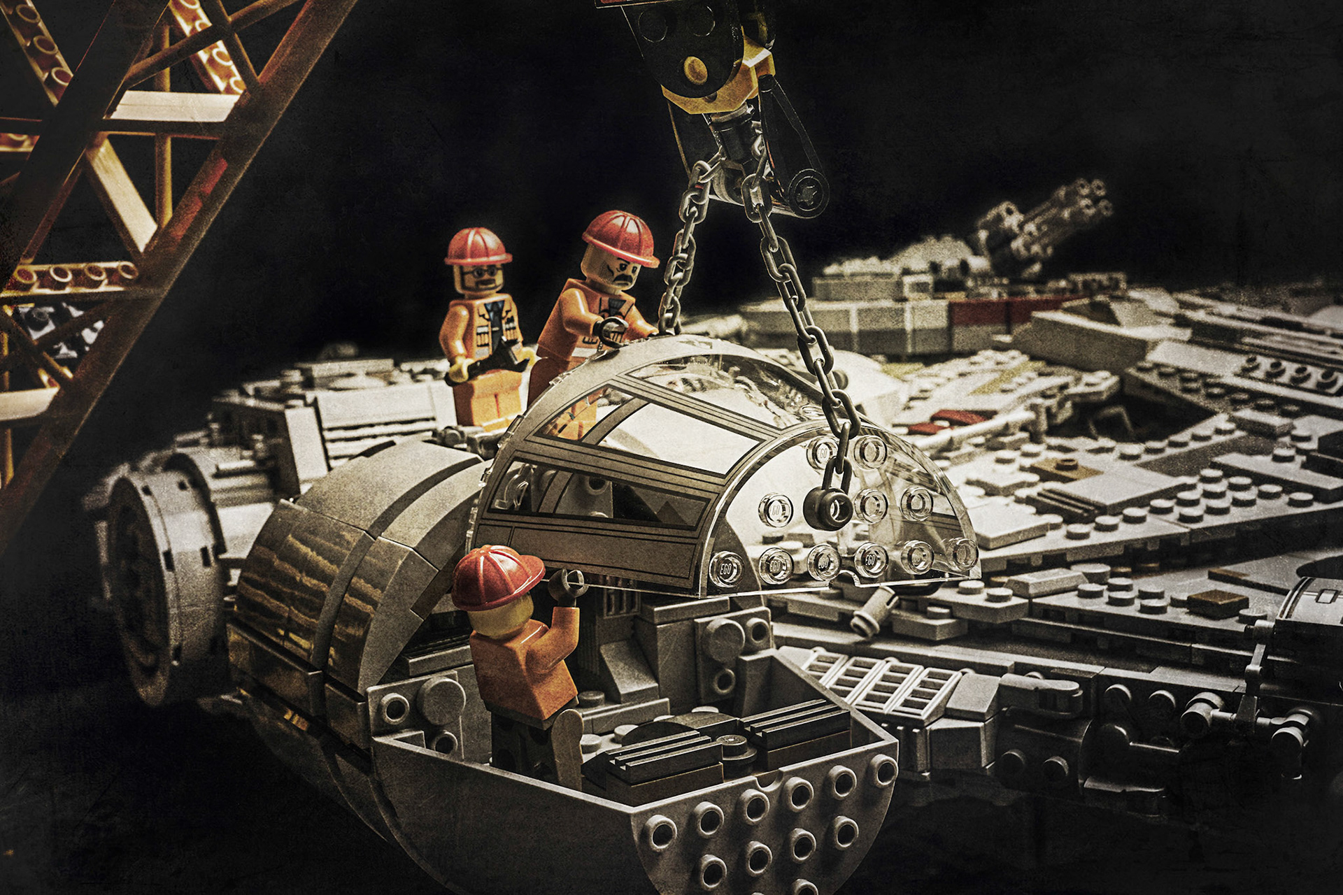 Historical photos of workers installing the main canopy of the MIllennium Falcon