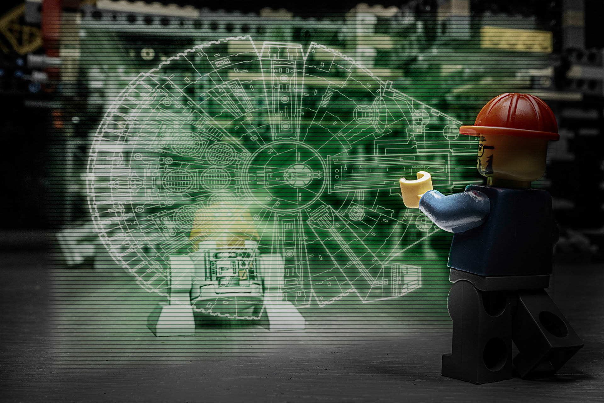 LEGO foreman looks at the blueprints for the Milennium Falcon
