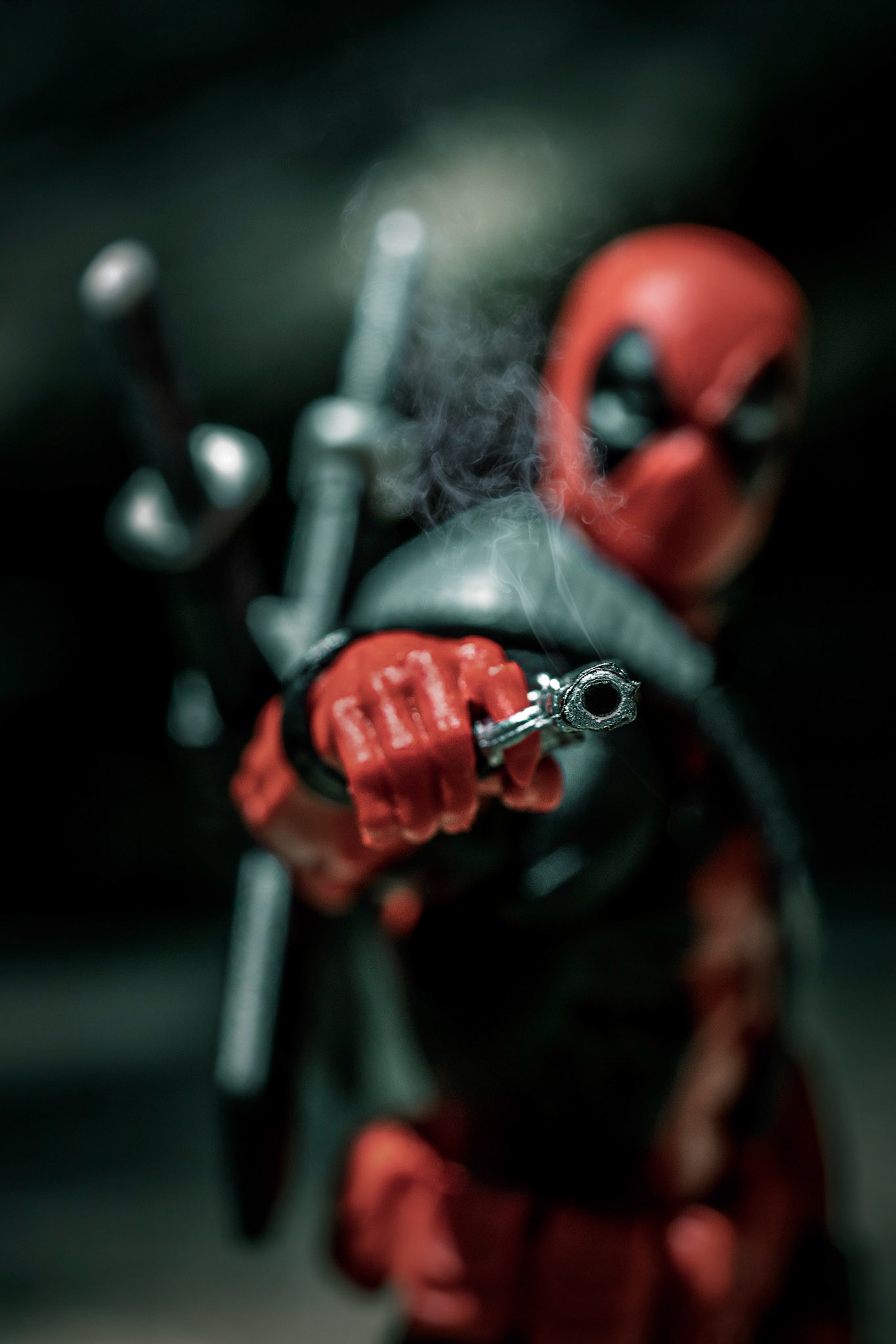 Deadpool firing a pistol