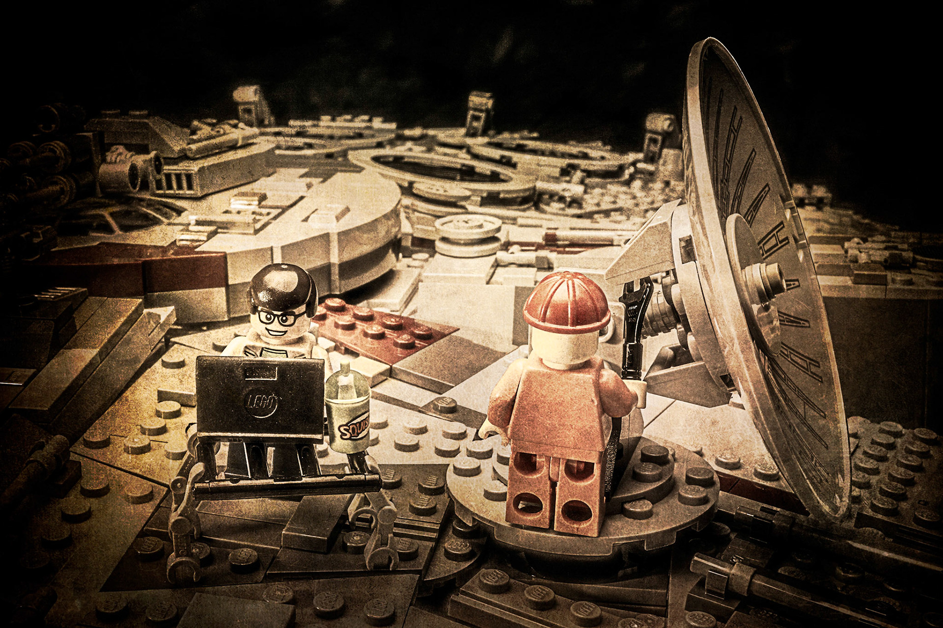 Historical photos of workers installing the radar dish on the Millennium Falcon