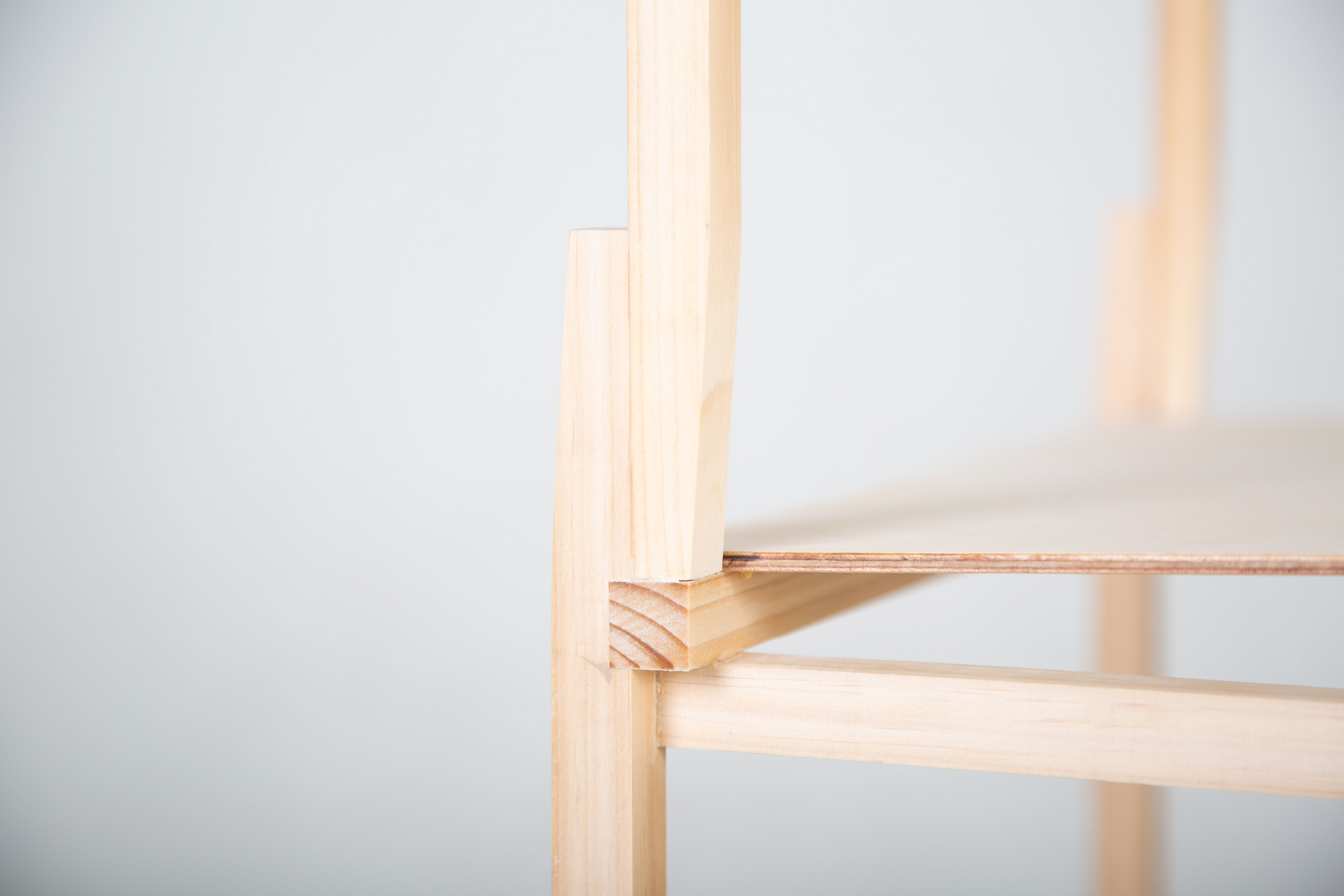 Orthogonal language is carefully transgressed to harmonically incorporate the crossbar into the backrest posts.
