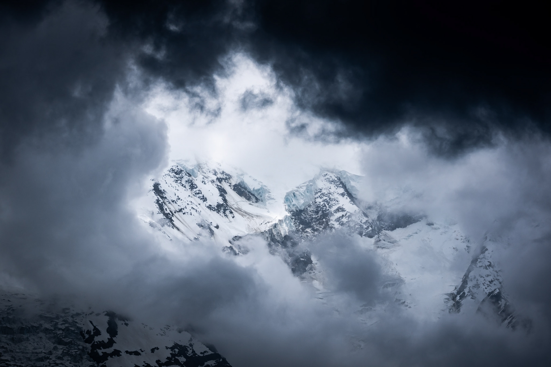 During my hikes in the Mont-Blanc valley, there were many occasions to take pictures of the surrounding mountain tops, but never was the sky the same. This time, there was a storm incoming, you could hear thunder echoing in the valley, but there was this incredible white light, surrounded by two different clouds one white and one dark. To me, this picture represents life and death, yin &amp; yang.