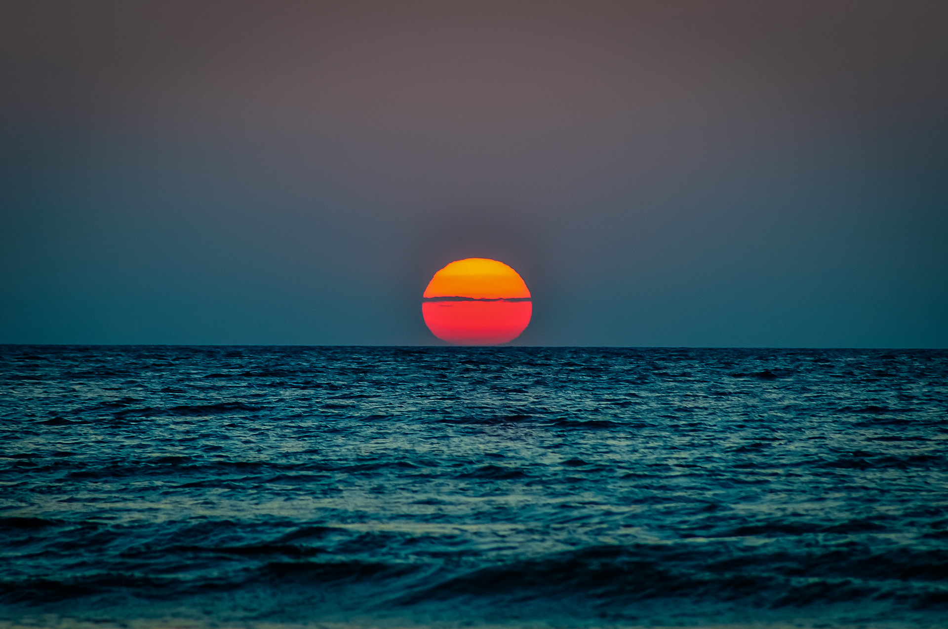 Layered sun due to the smoke from the Caliornia wildfires moving across the country; Mackinaw City, MI. August 2018