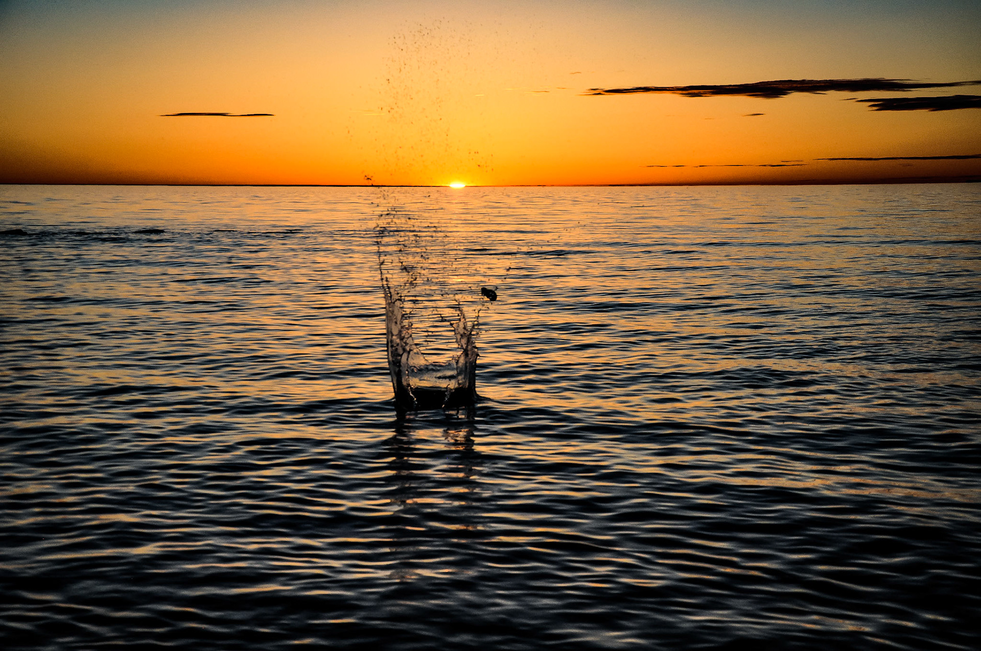 Rock skipping on the lake at sunset after I took PLENTY of normal sunset shots...