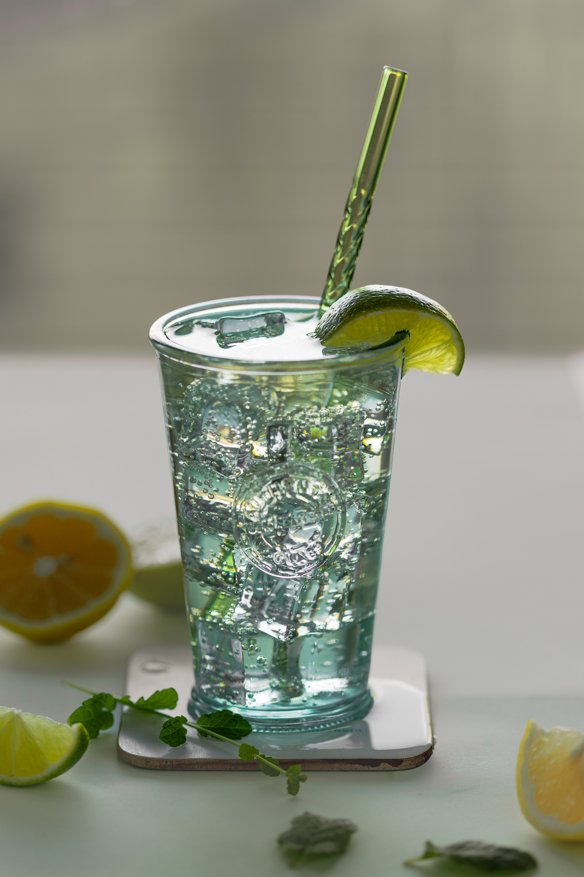 Lemon and lime sparkling water with fresh mint, beverage photography
