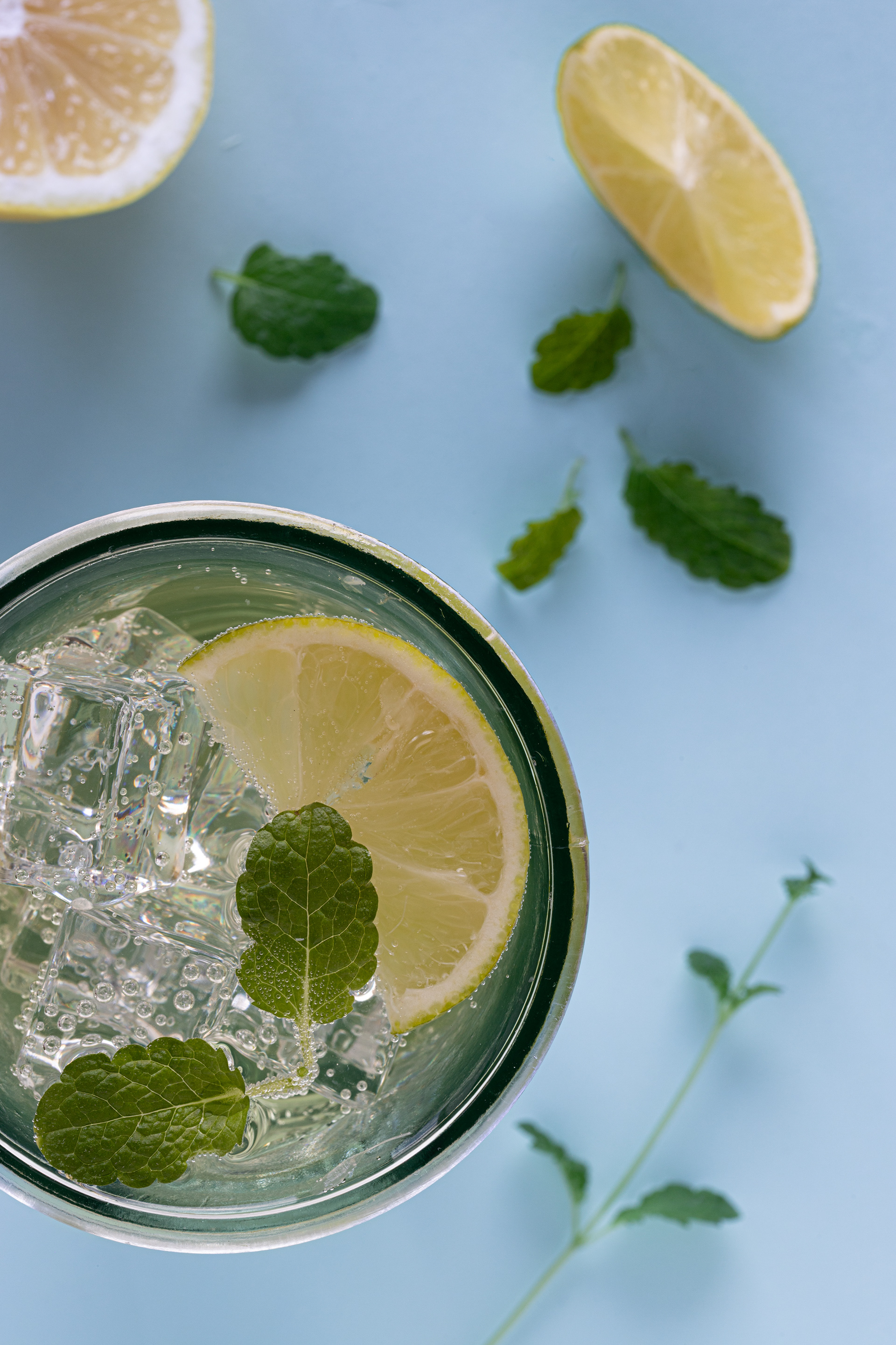 Lemon and lime sparkling water with fresh mint, beverage photography