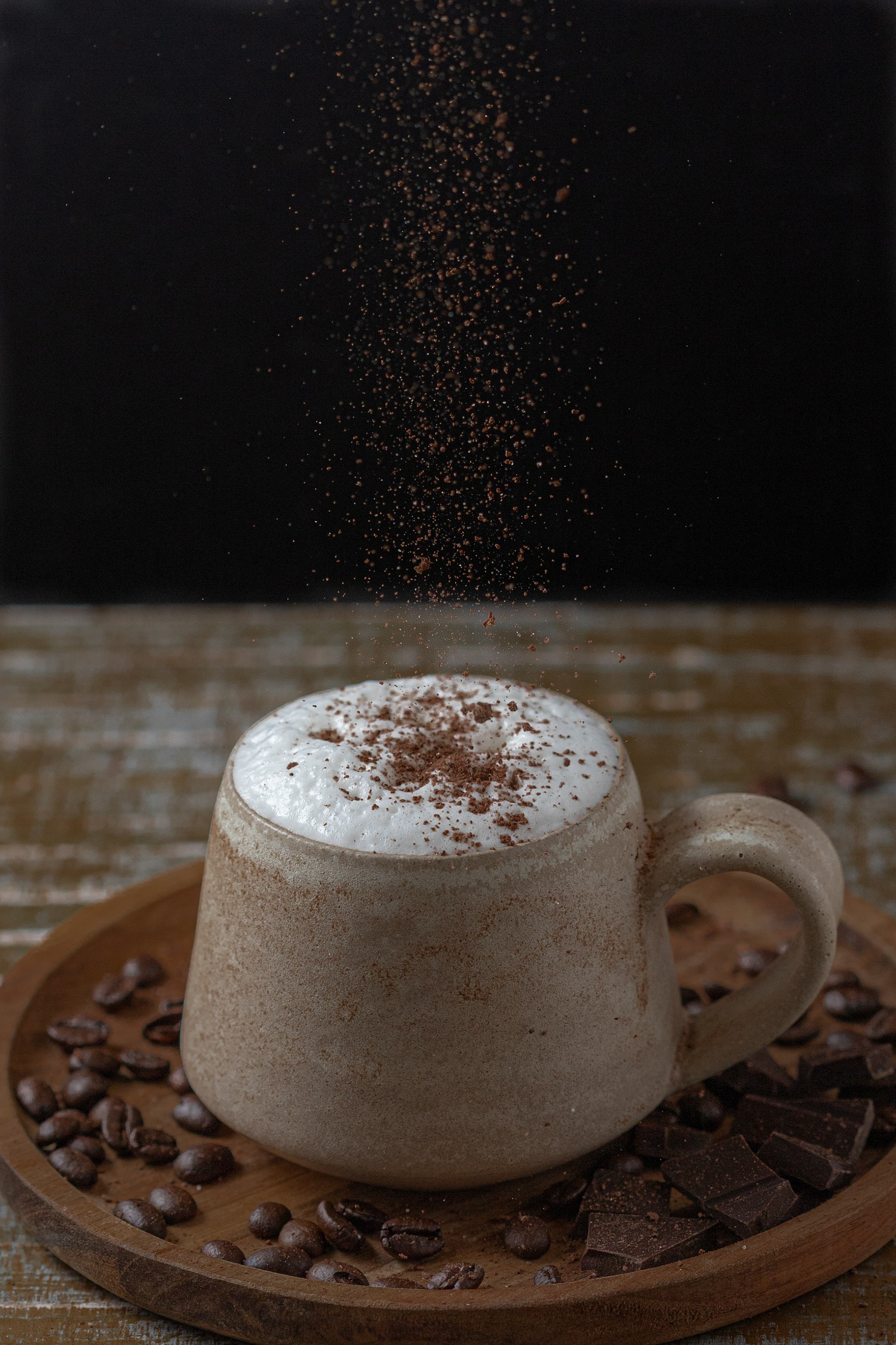 Dark and moody shoot of  cappuccino with chocolate sprinkles