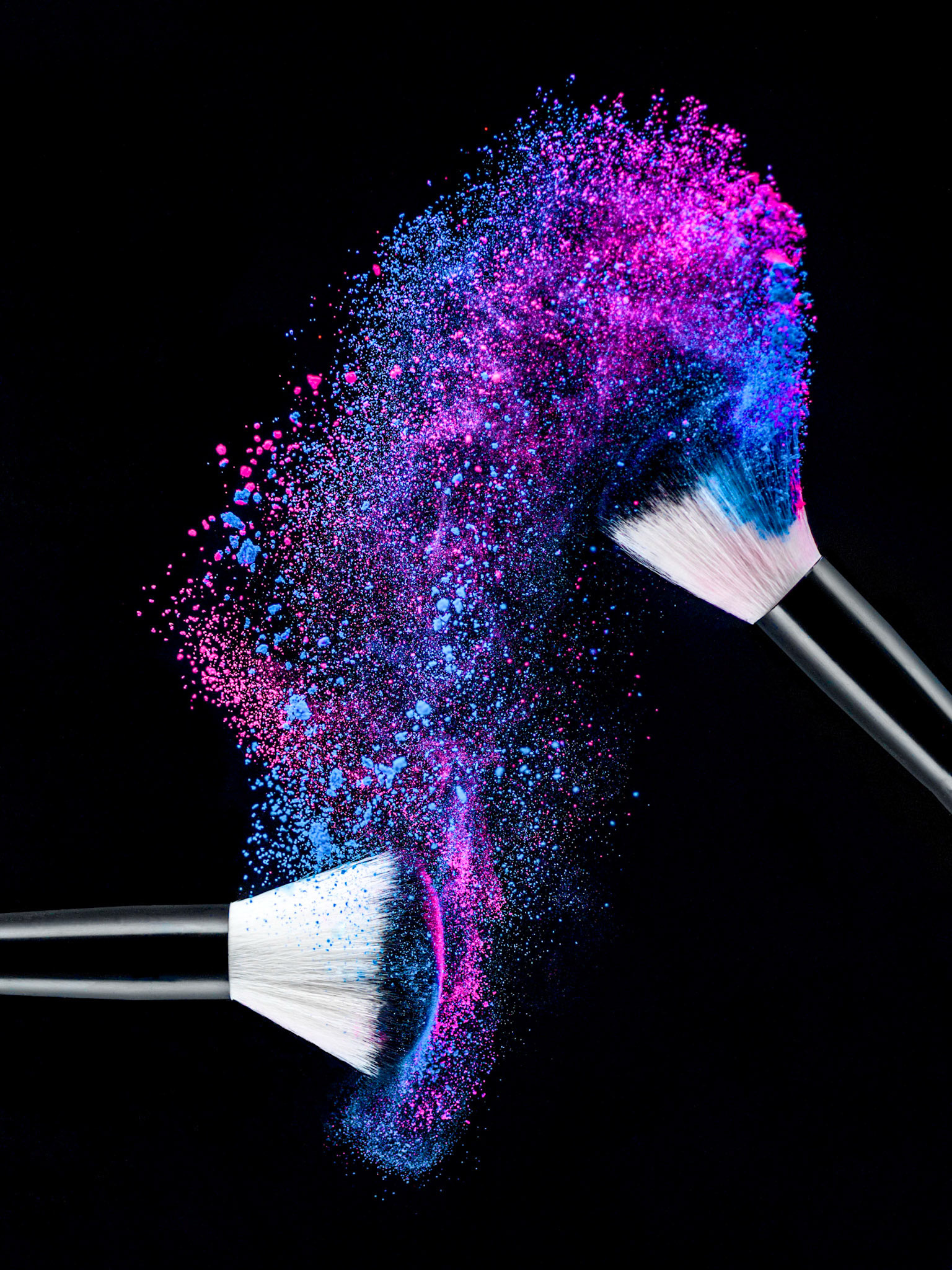 Moment in time image of powder swept across brushes