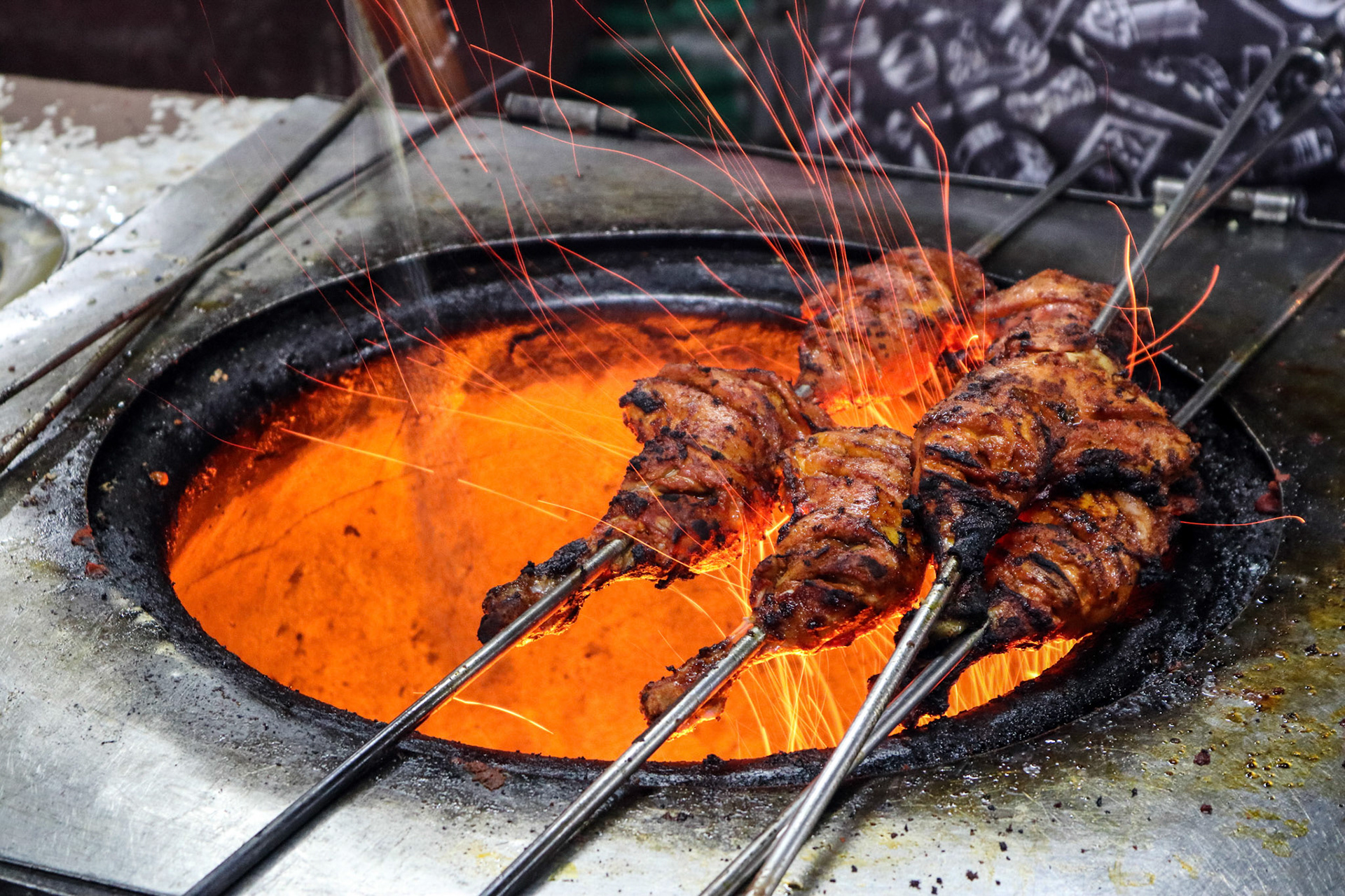 Tandoori Chicken cooked fire flame oven with gas and charcoal