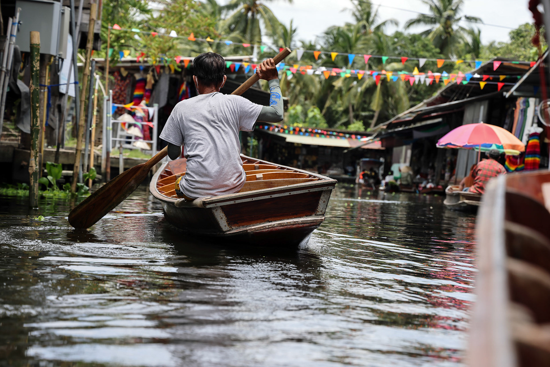 Damnoen Saduak, Thailand-May 26. 2022- The famous Damnoen Saduak, floating market near Bangkok, visited by tourist after opening from covid-19 pandemic lockdown.