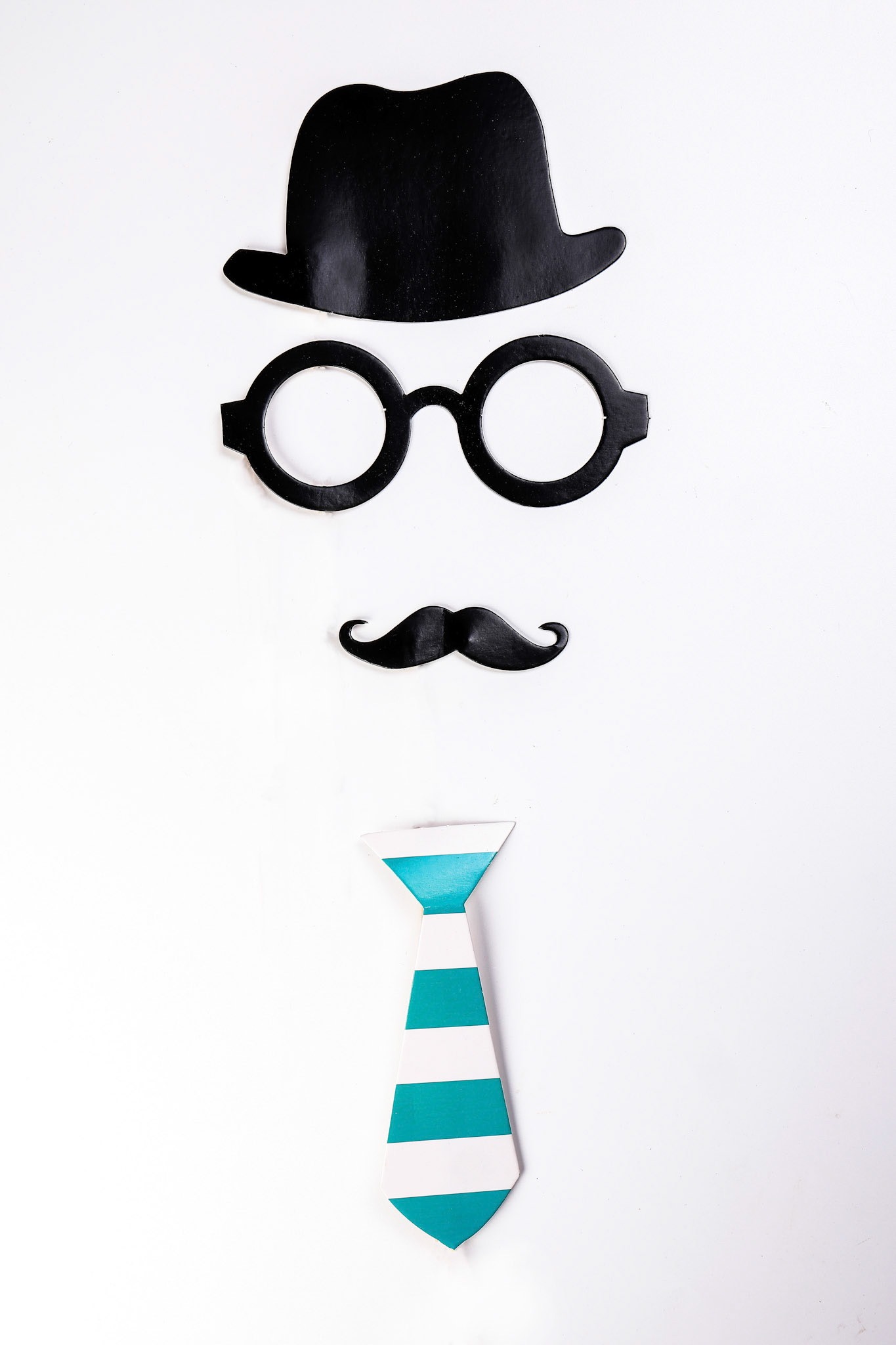 Black hat round eyewear spectacle frame moustache blue neck bow tie face shape paper die cut selfie portrait party fun paper prop sticker stick on white background