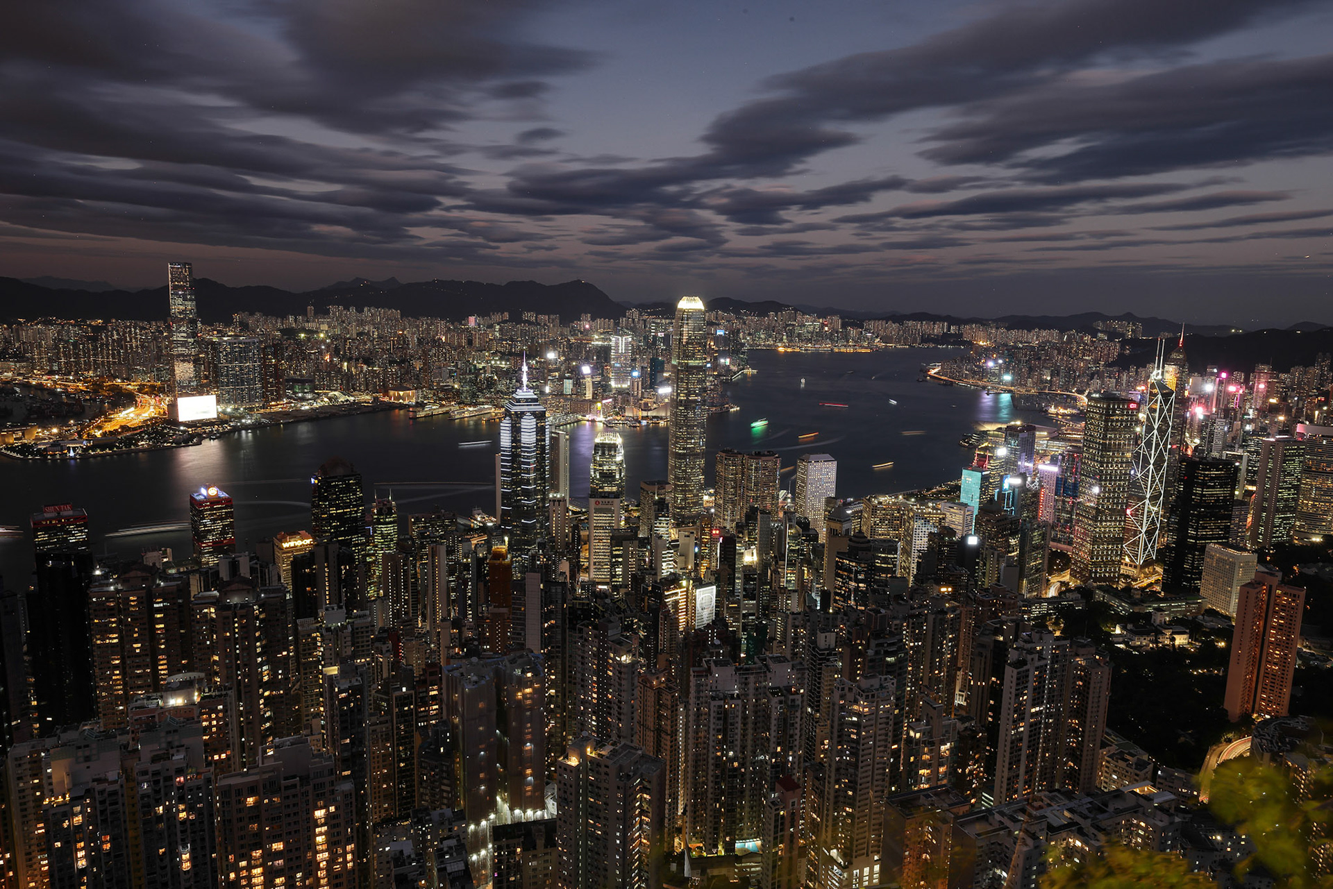 Hong Kong-November 16, 2023- View of Hong Kong and Kowloon form top of  Victoria Peak. Blue hour dusk to sun down.